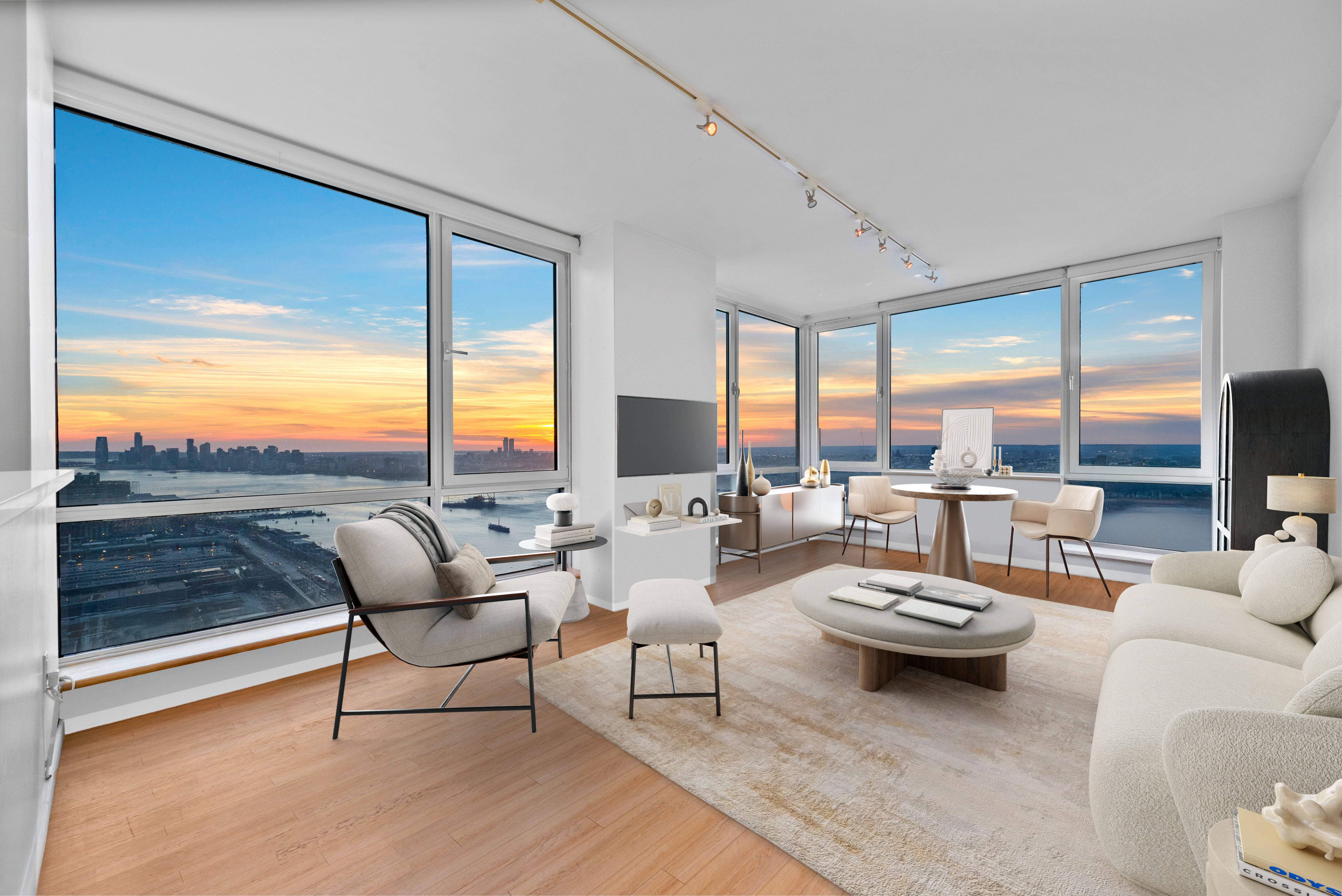 a living room with furniture and floor to ceiling window