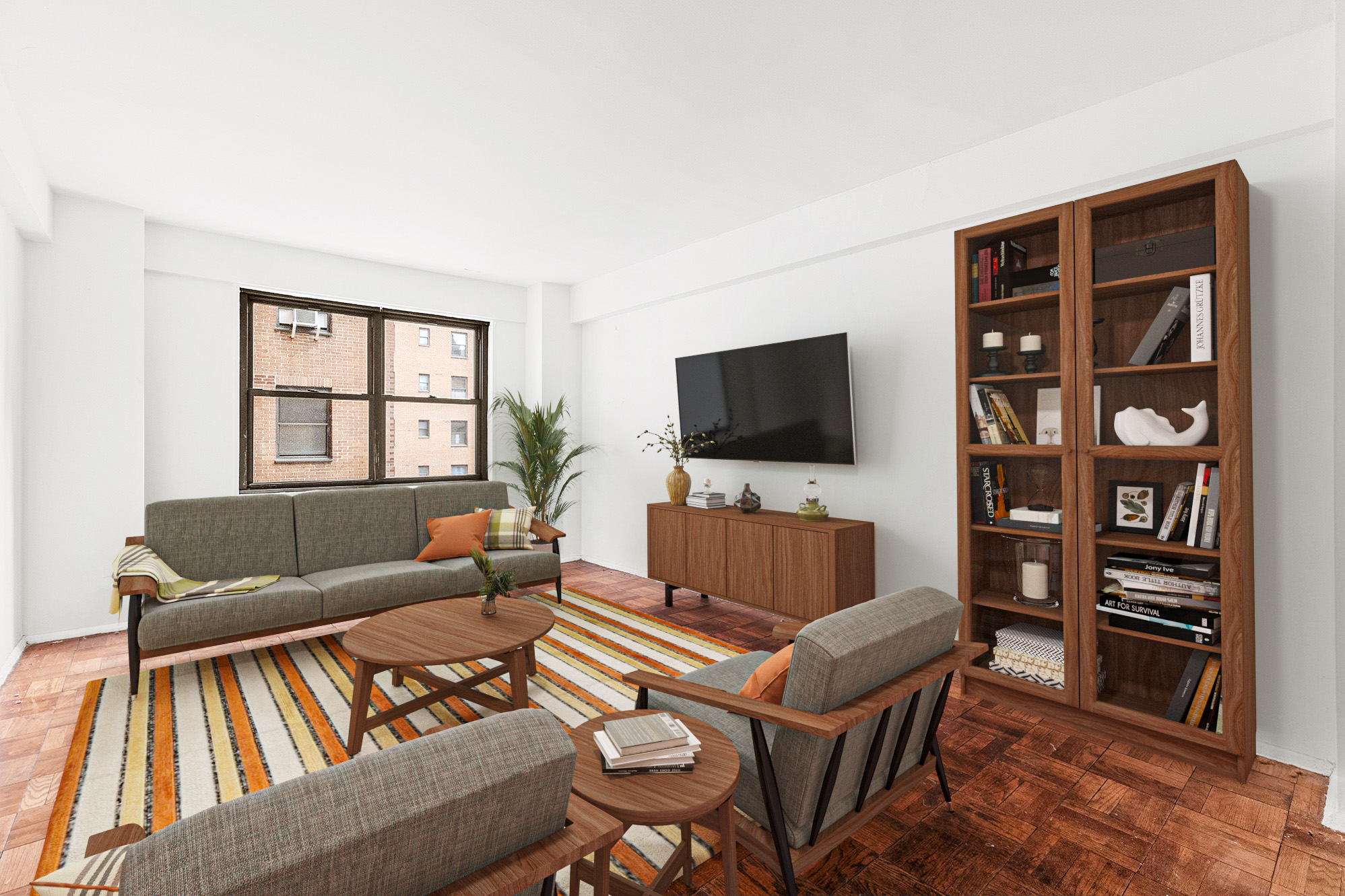 a living room with furniture a flat screen tv and a bookshelf