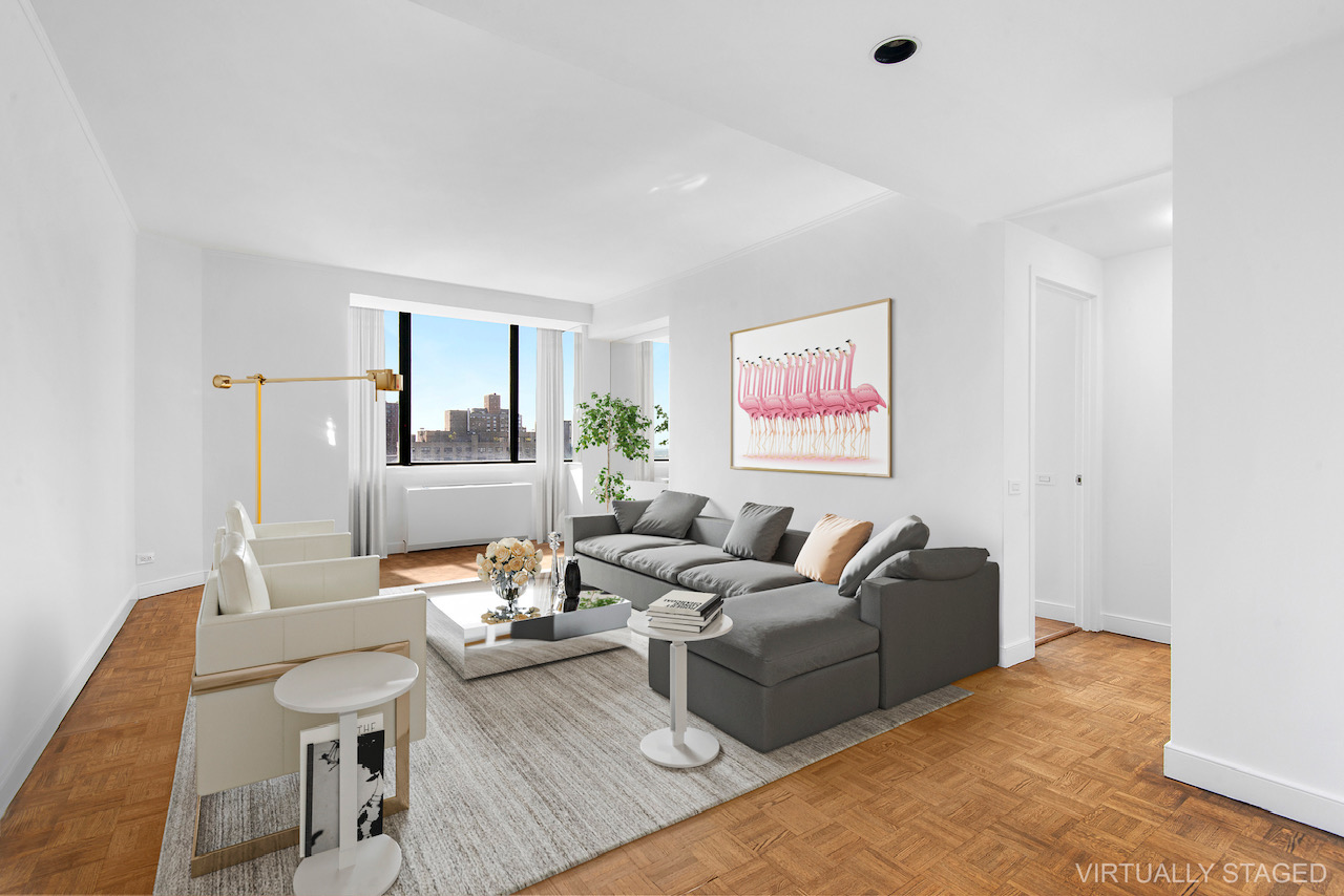 a living room with furniture and a table