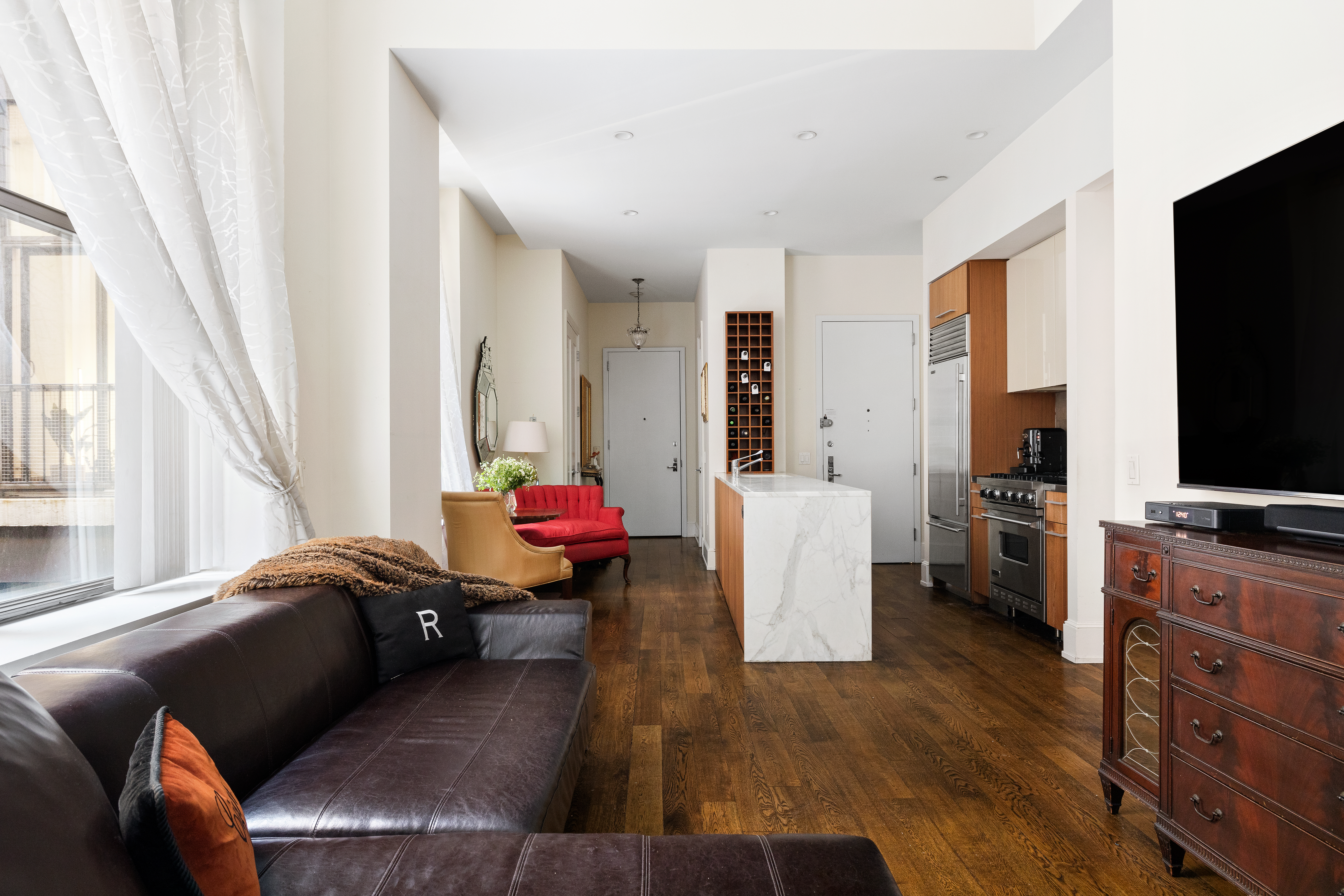 a living room with furniture and a flat screen tv