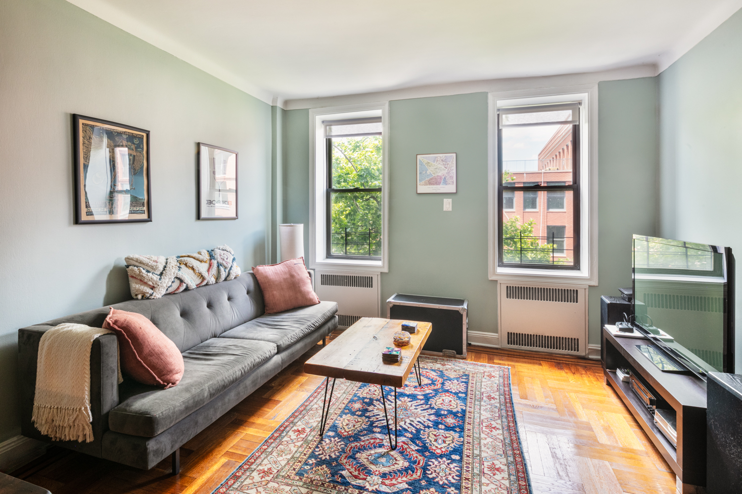 a living room with furniture and a flat screen tv