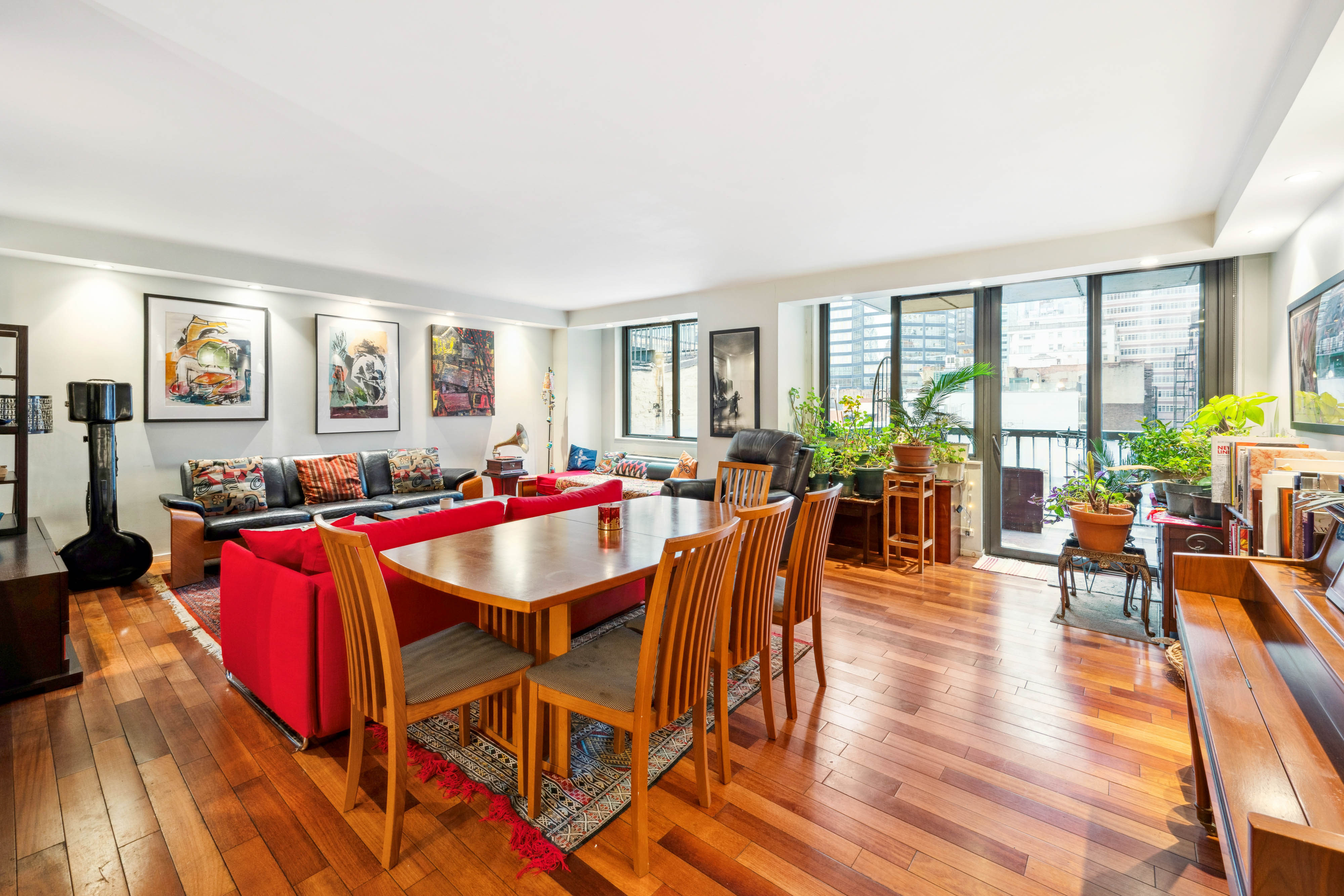 a view of a dining room with furniture window and wooden floor