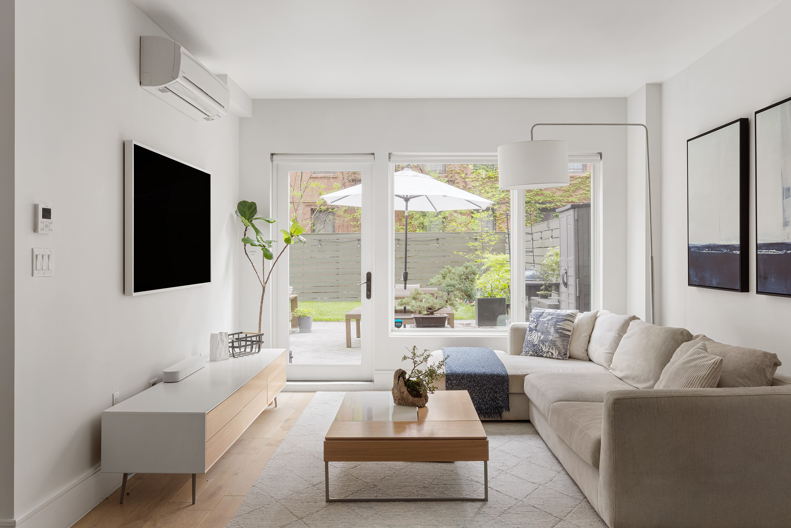 a living room with furniture and a large window