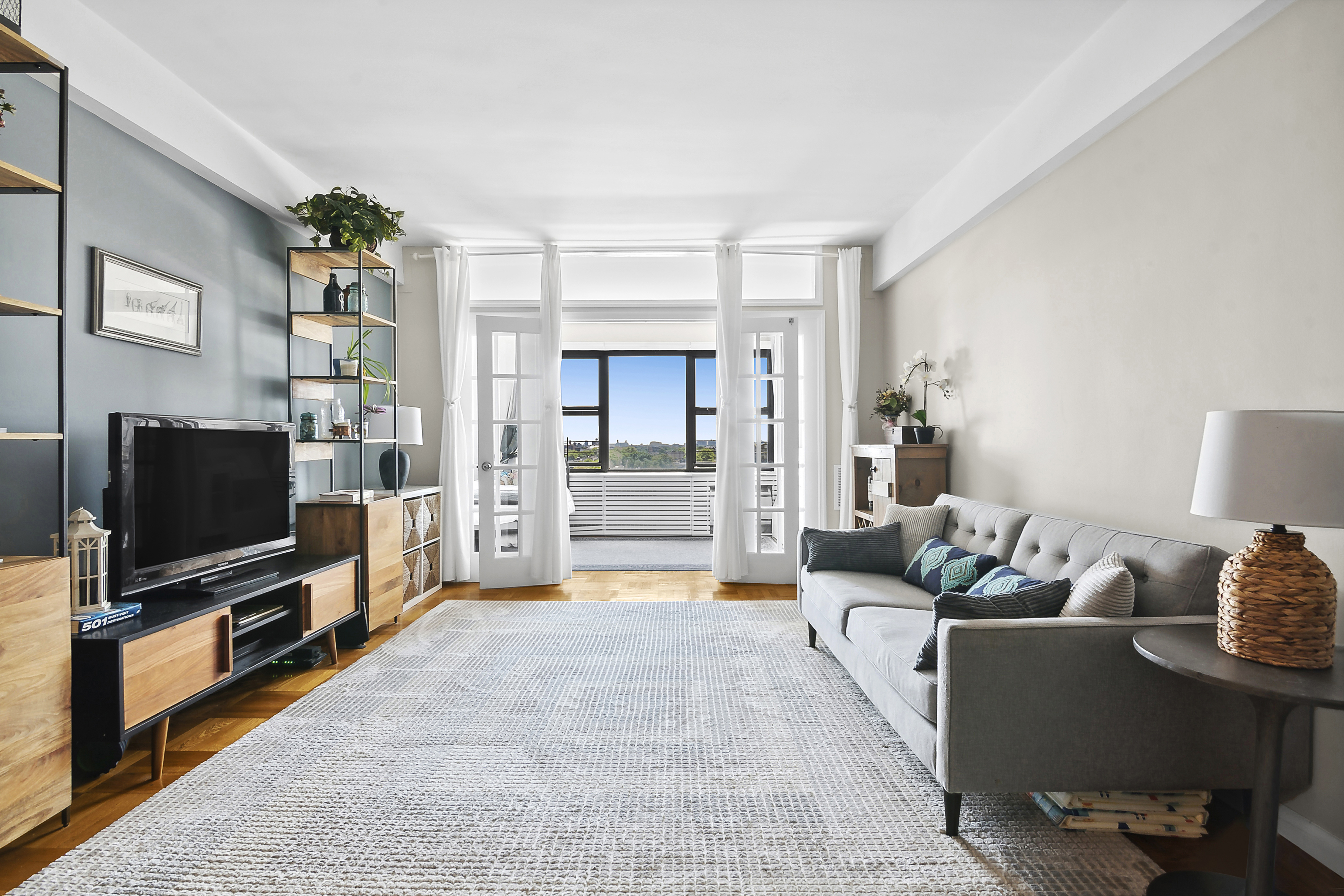 a living room with furniture and a flat screen tv