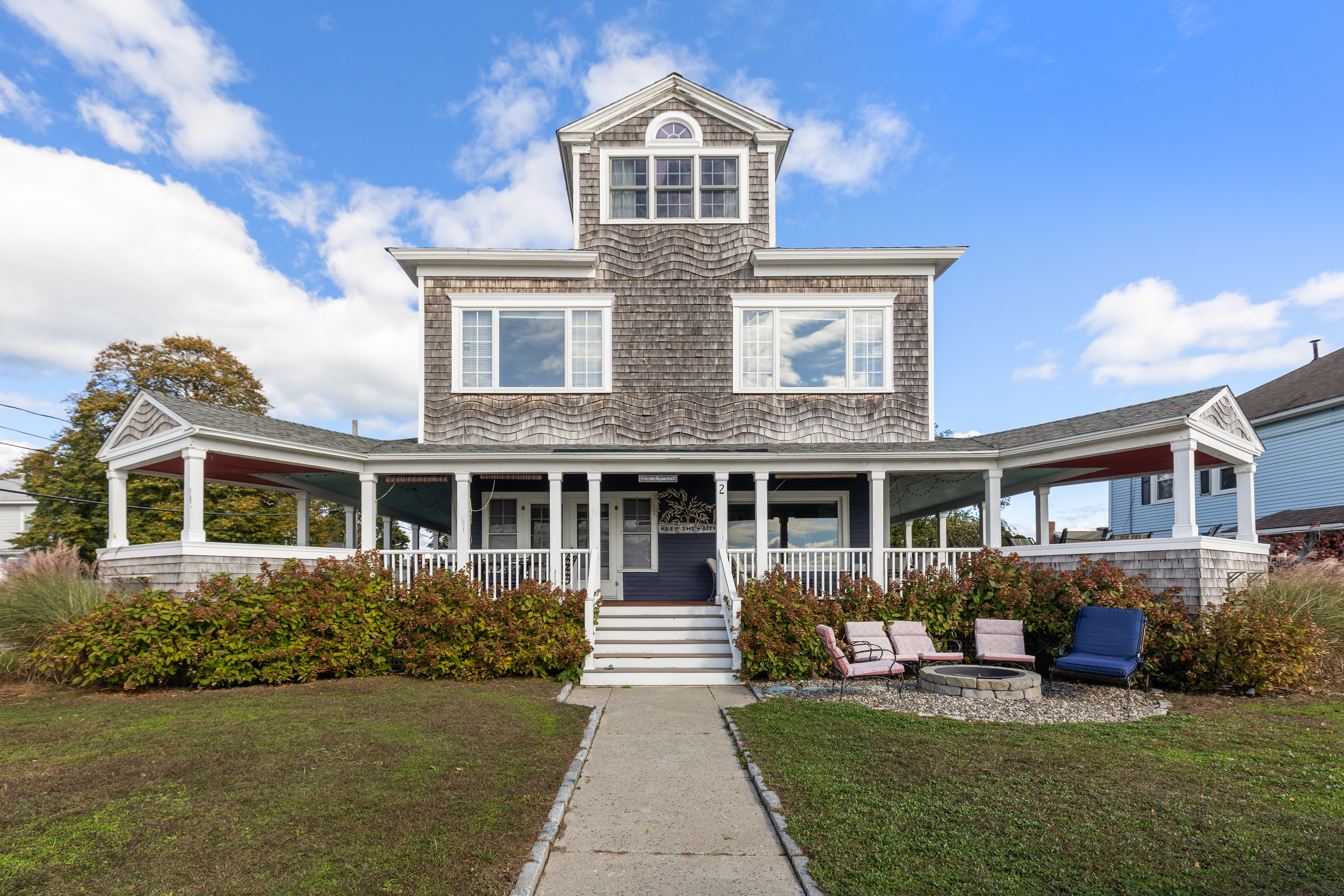 a front view of a house with garden