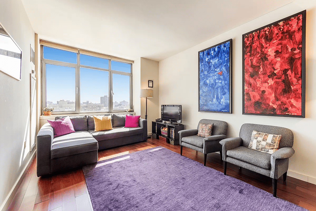 a living room with furniture and a rug