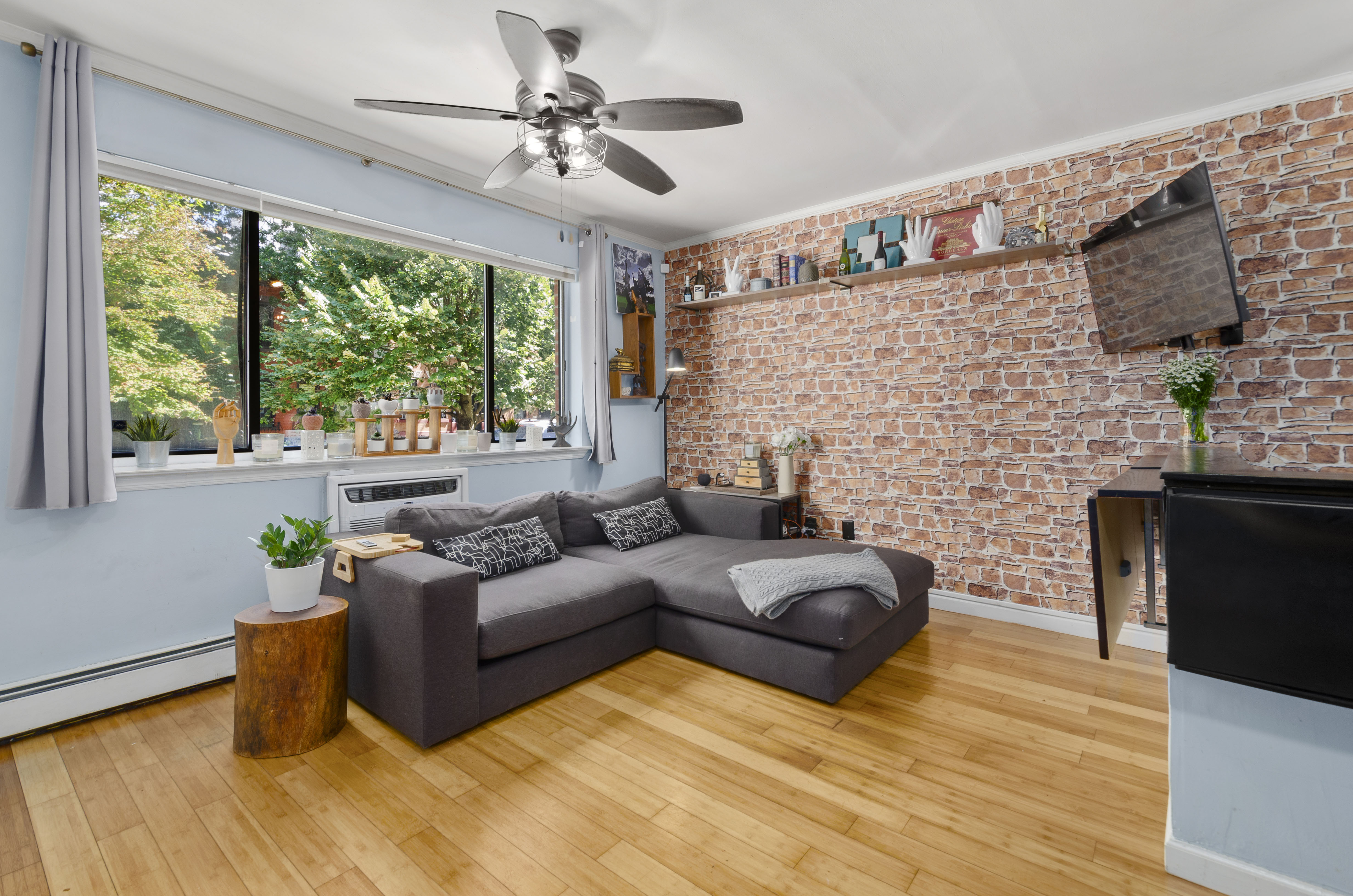 a living room with furniture and a fireplace