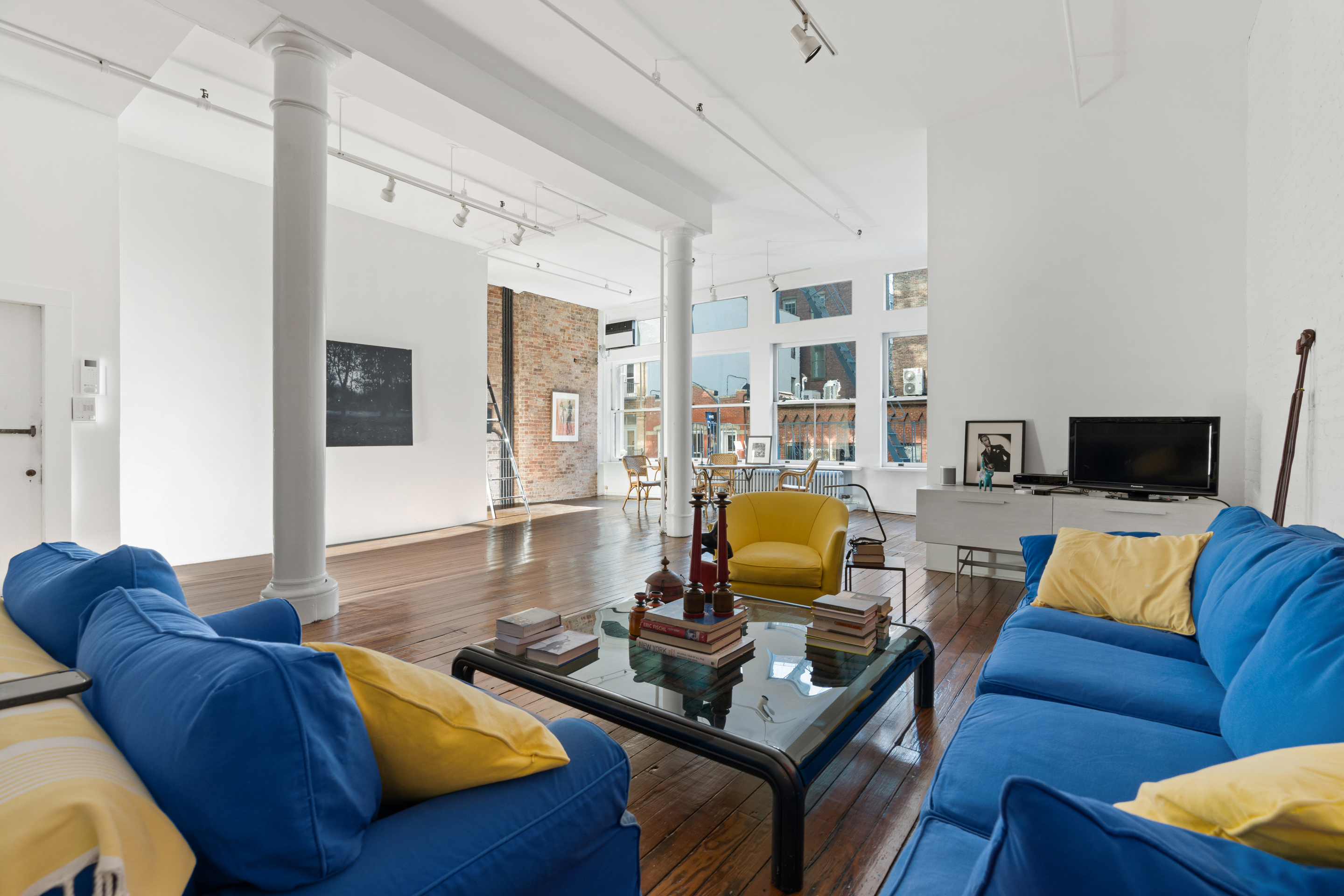 a living room with furniture and a flat screen tv