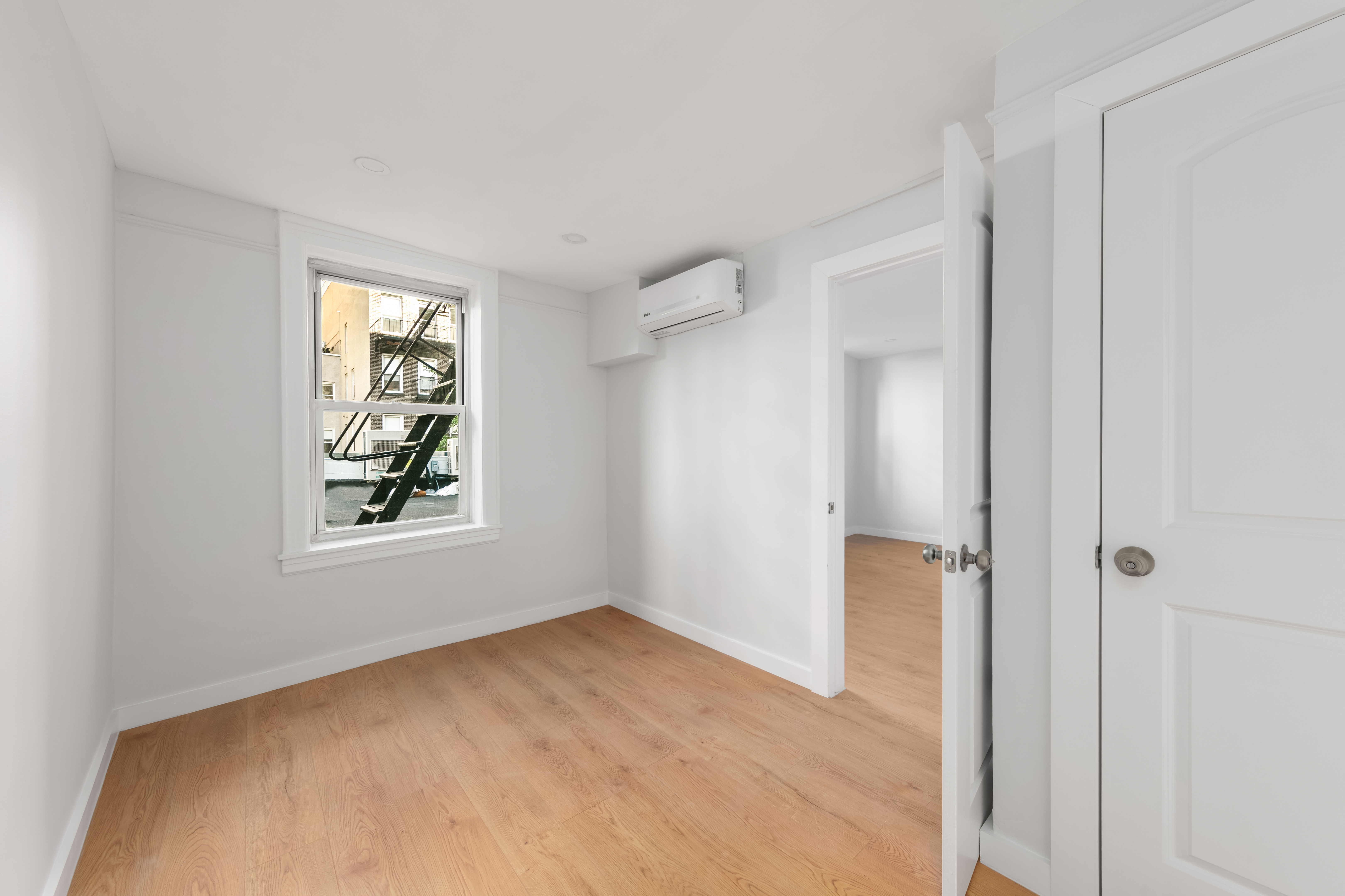 a view of an empty room with a window