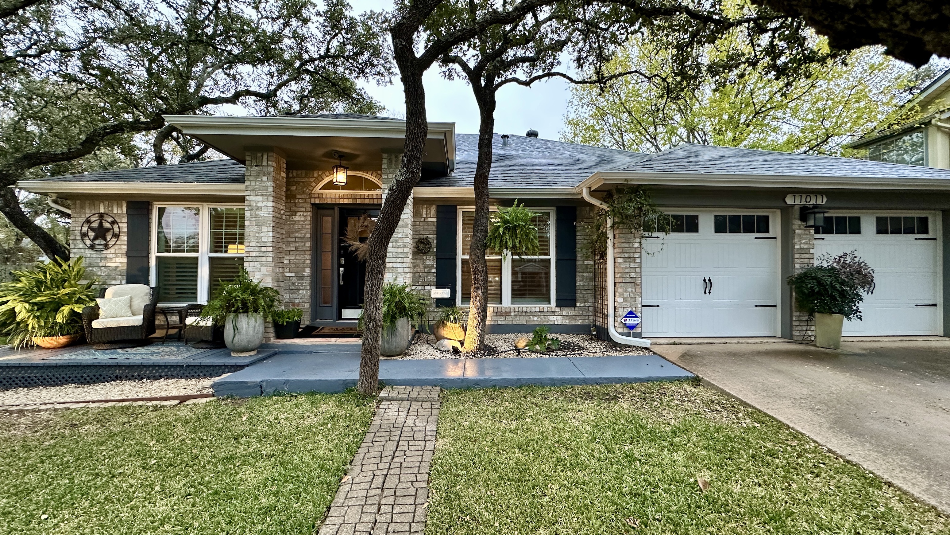 a front view of a house with garden