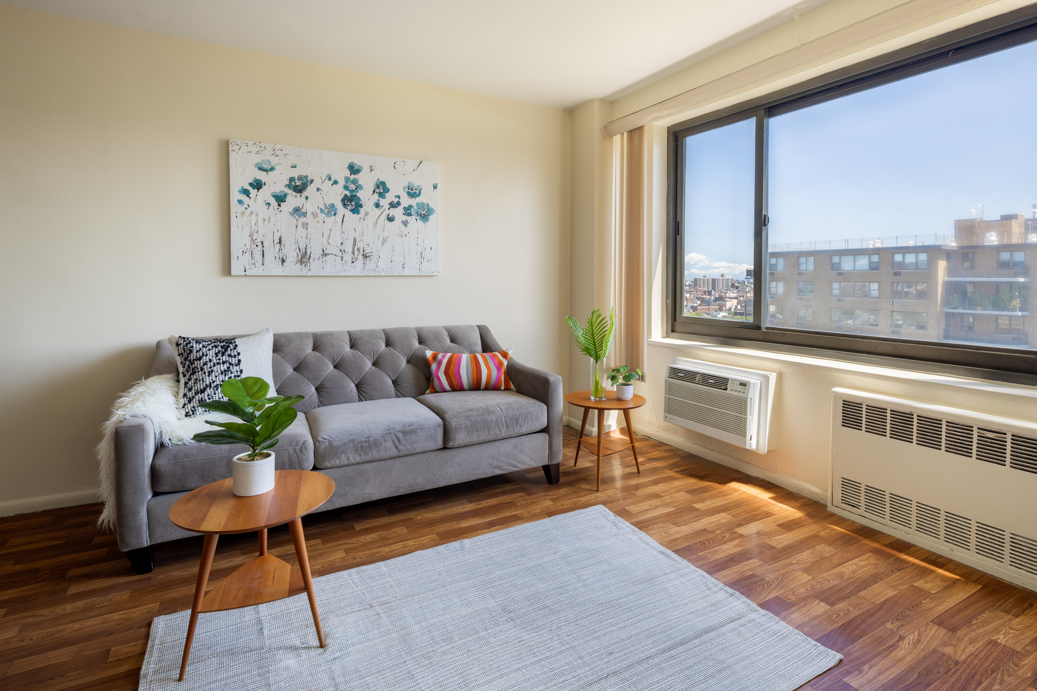 a living room with furniture and a large window