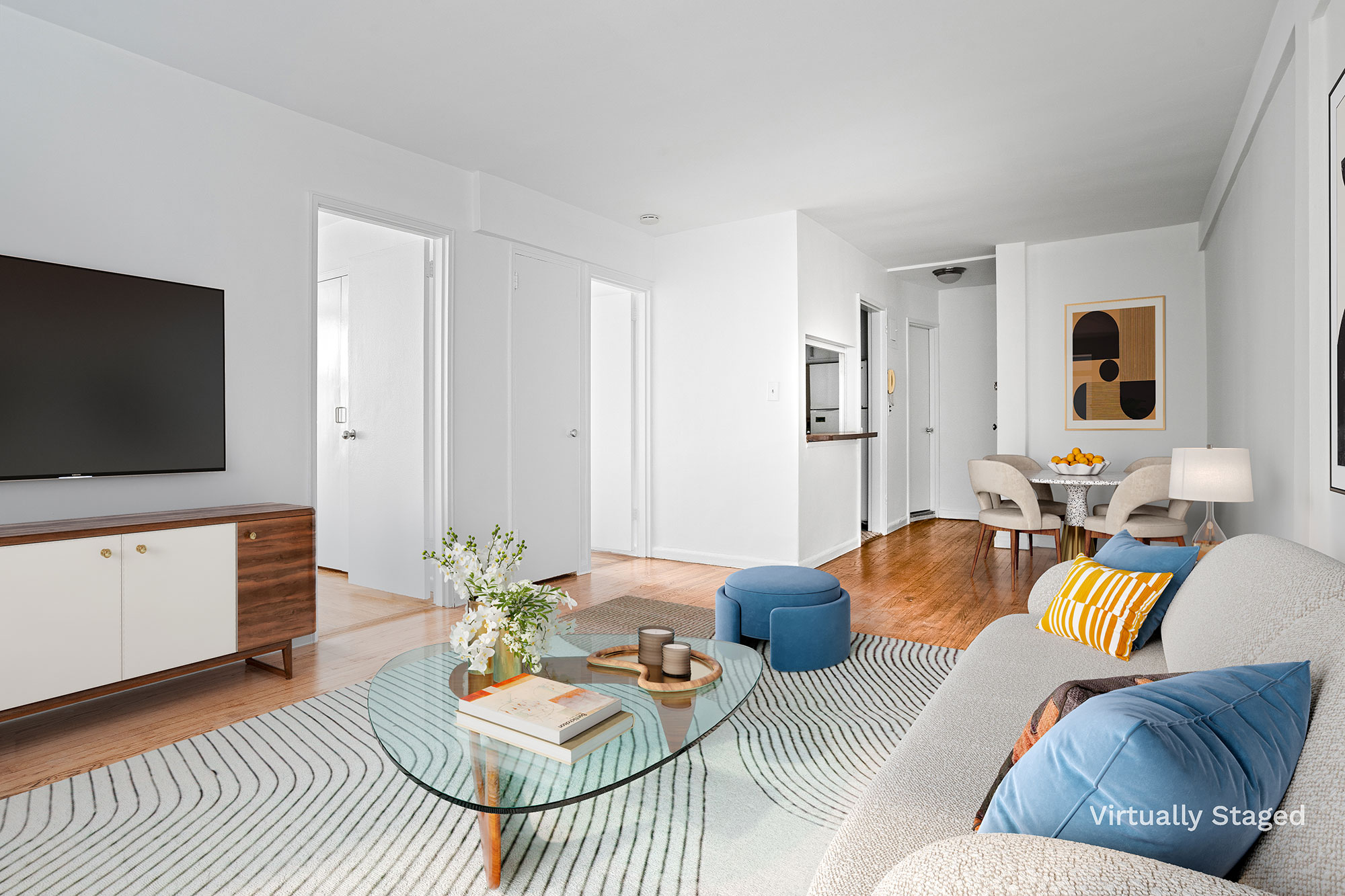 a living room with furniture and a flat screen tv