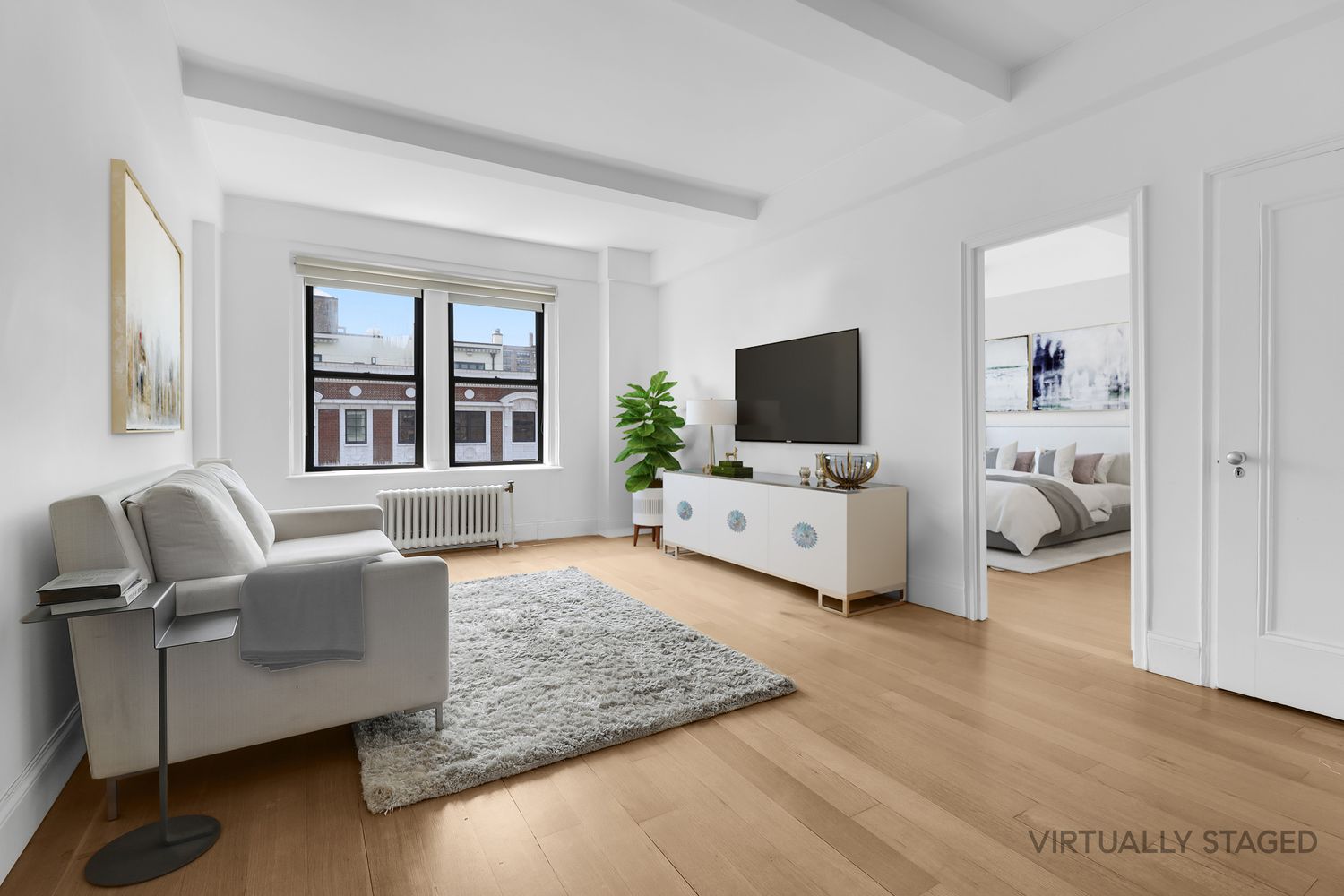 a living room with furniture and a flat screen tv