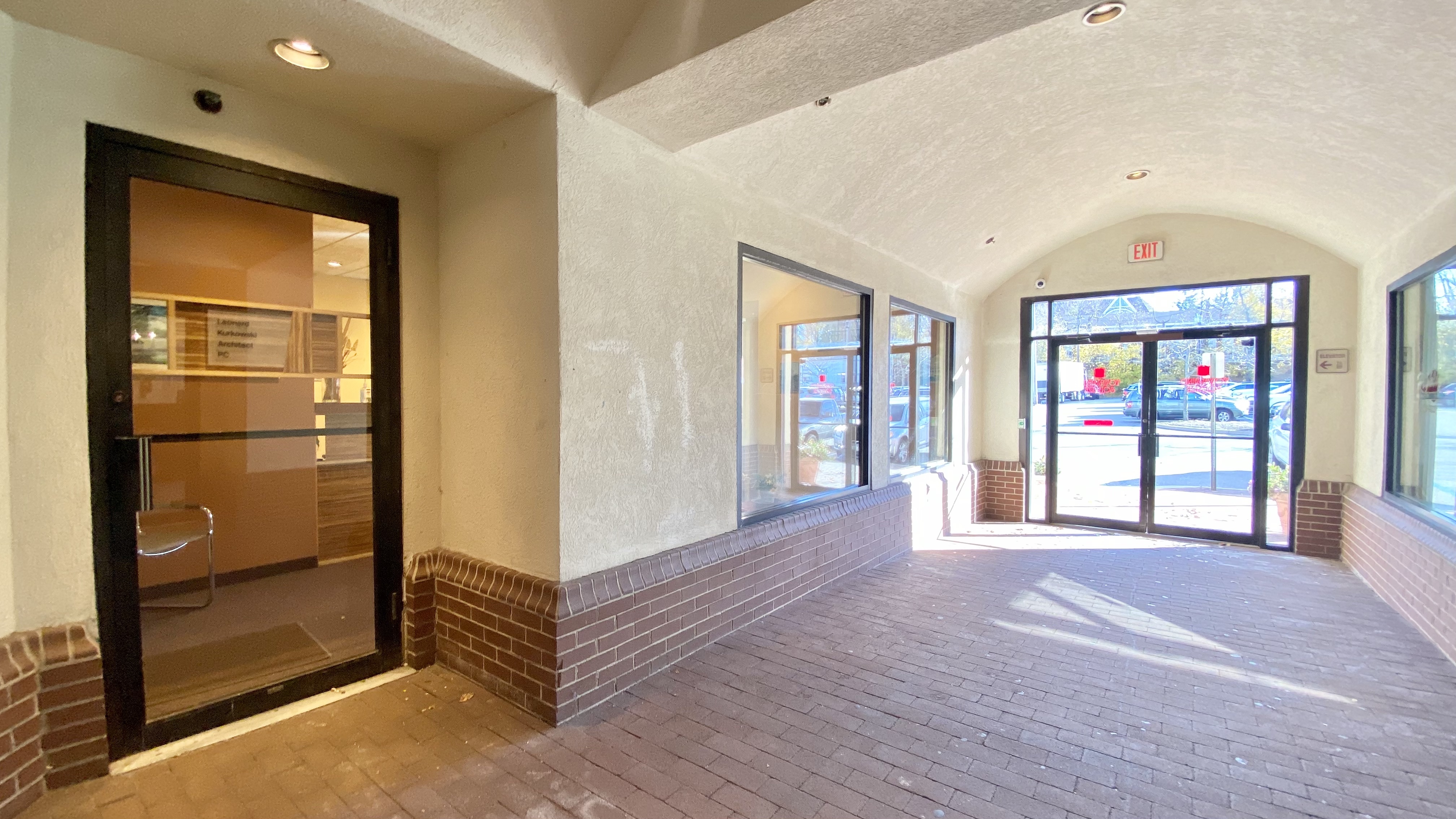 a view of an empty room with glass door