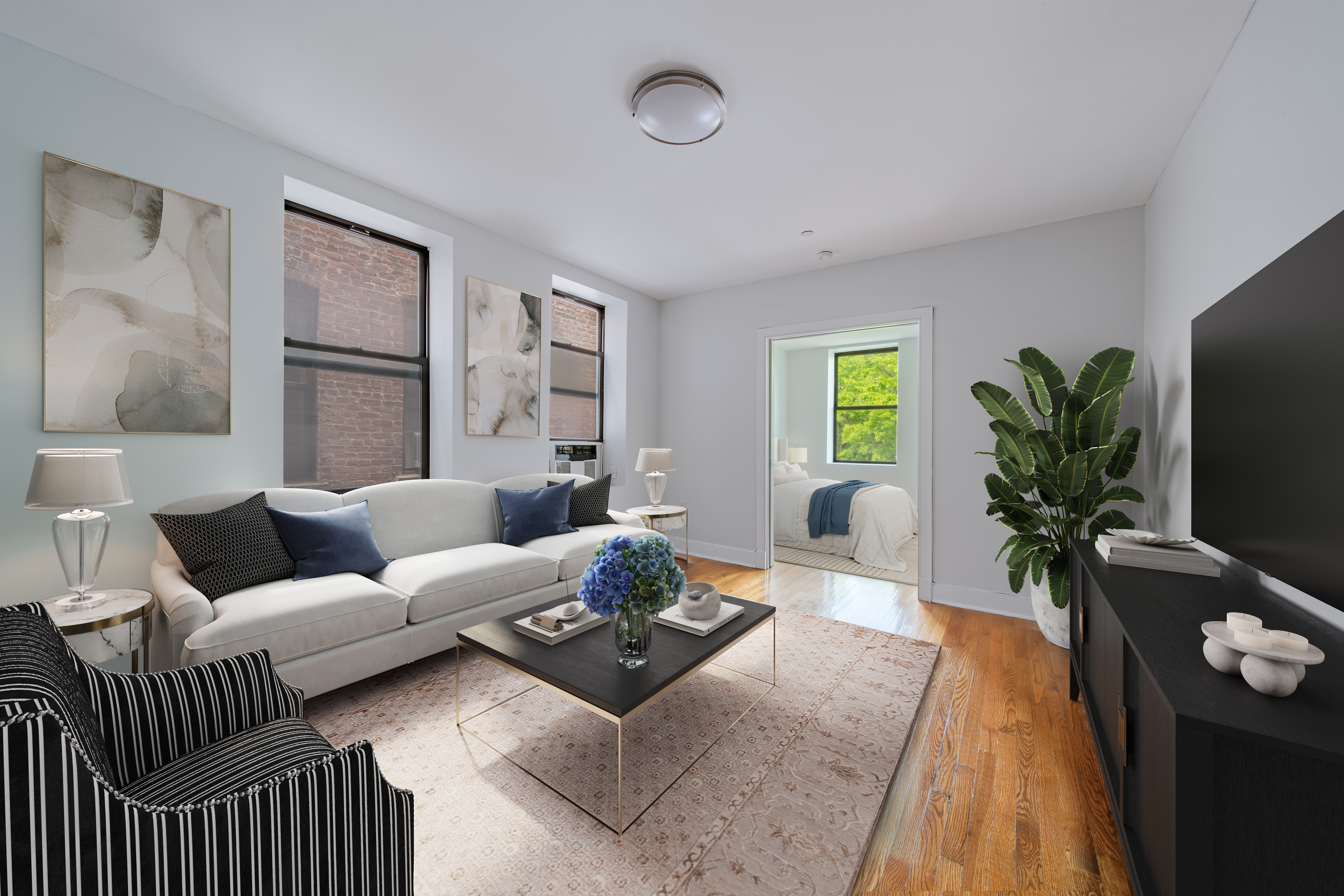 a living room with furniture and a flat screen tv