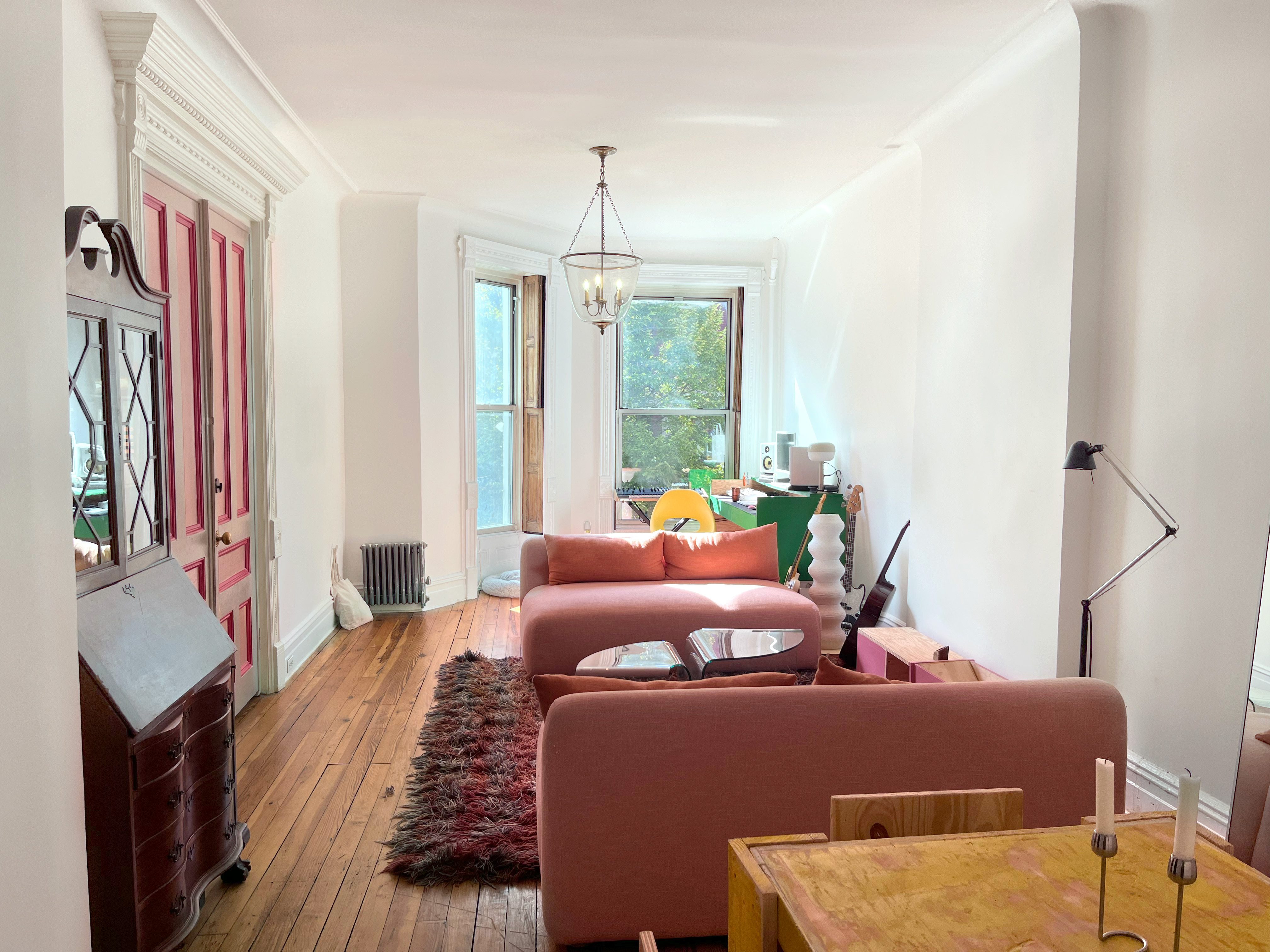 a bedroom with furniture and a chandelier