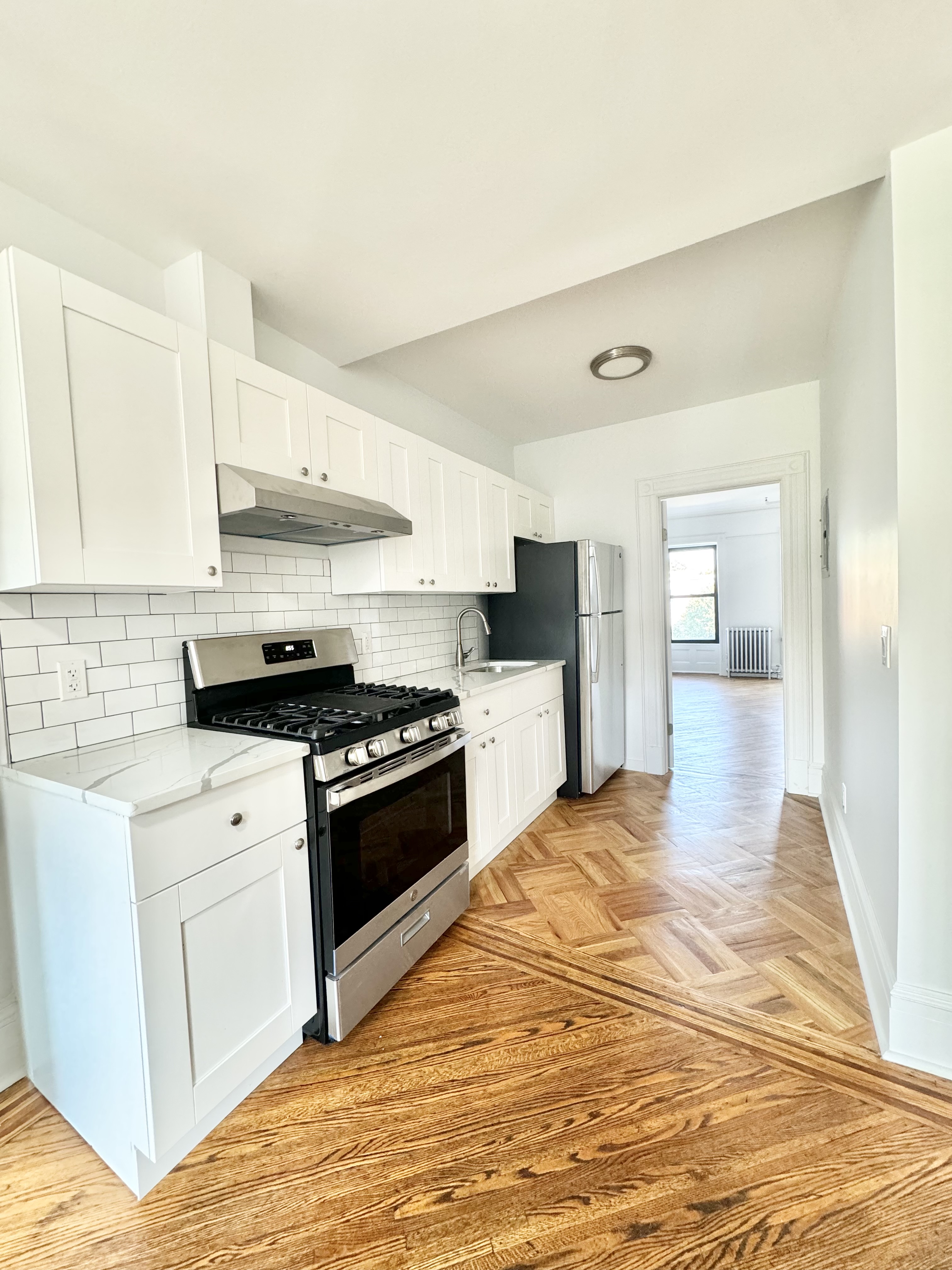 a kitchen with stainless steel appliances granite countertop a stove and a sink