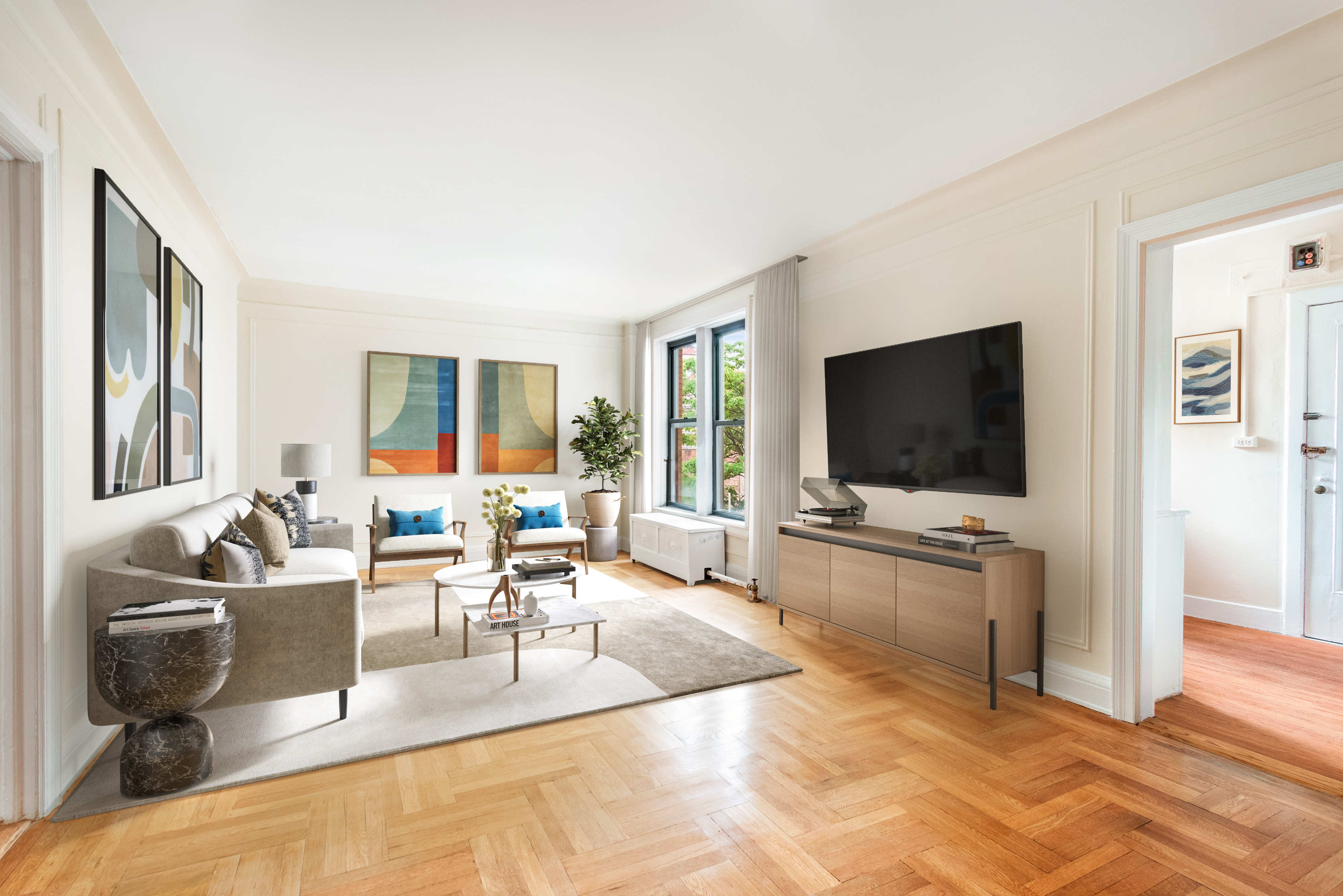 a living room with furniture and a flat screen tv