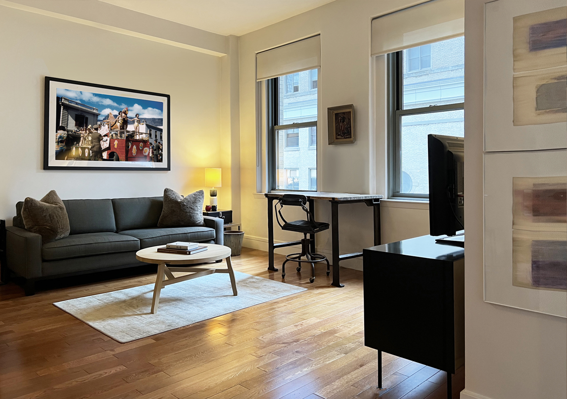 a living room with furniture a dining table and with wooden floor