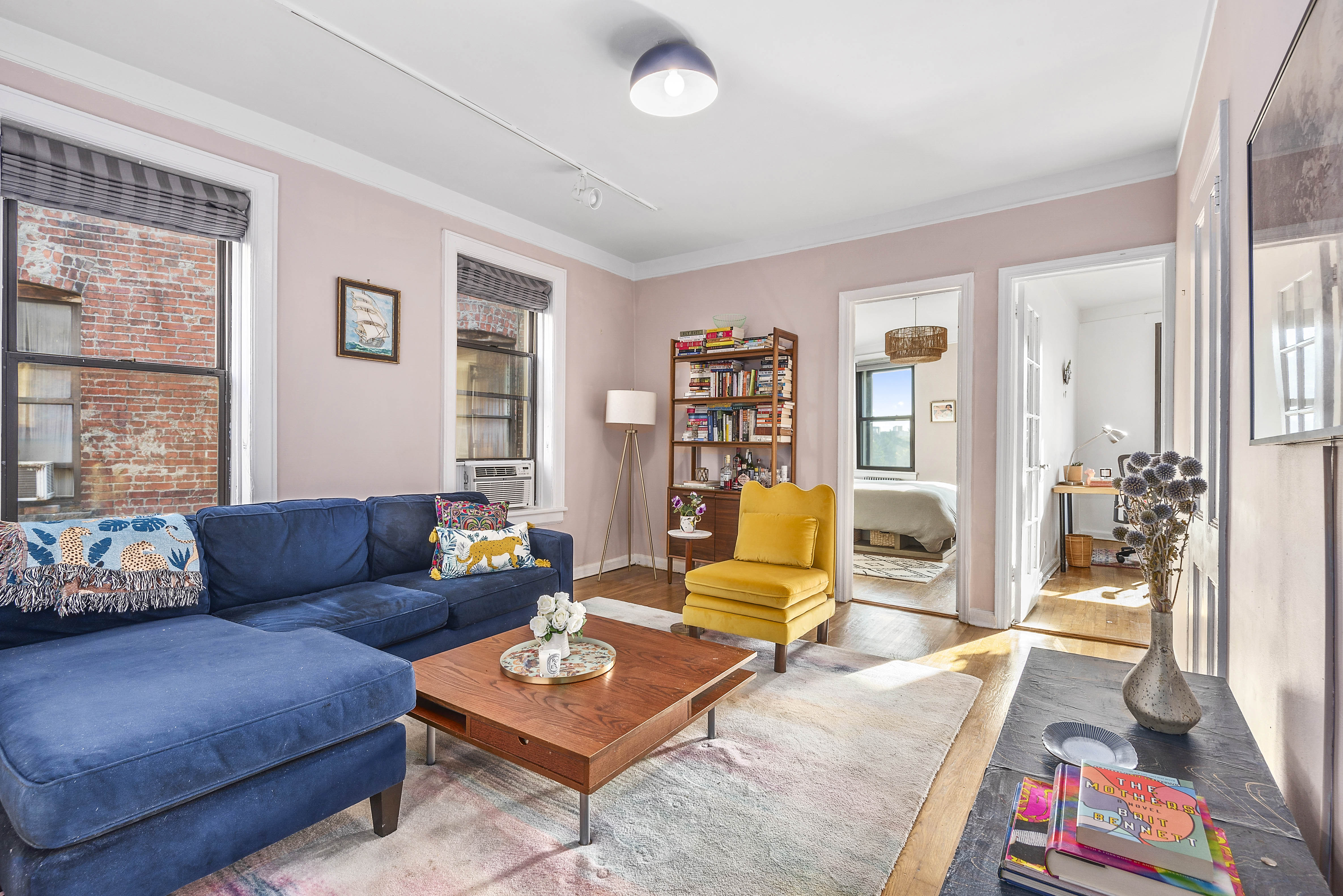 a living room with furniture and a large window