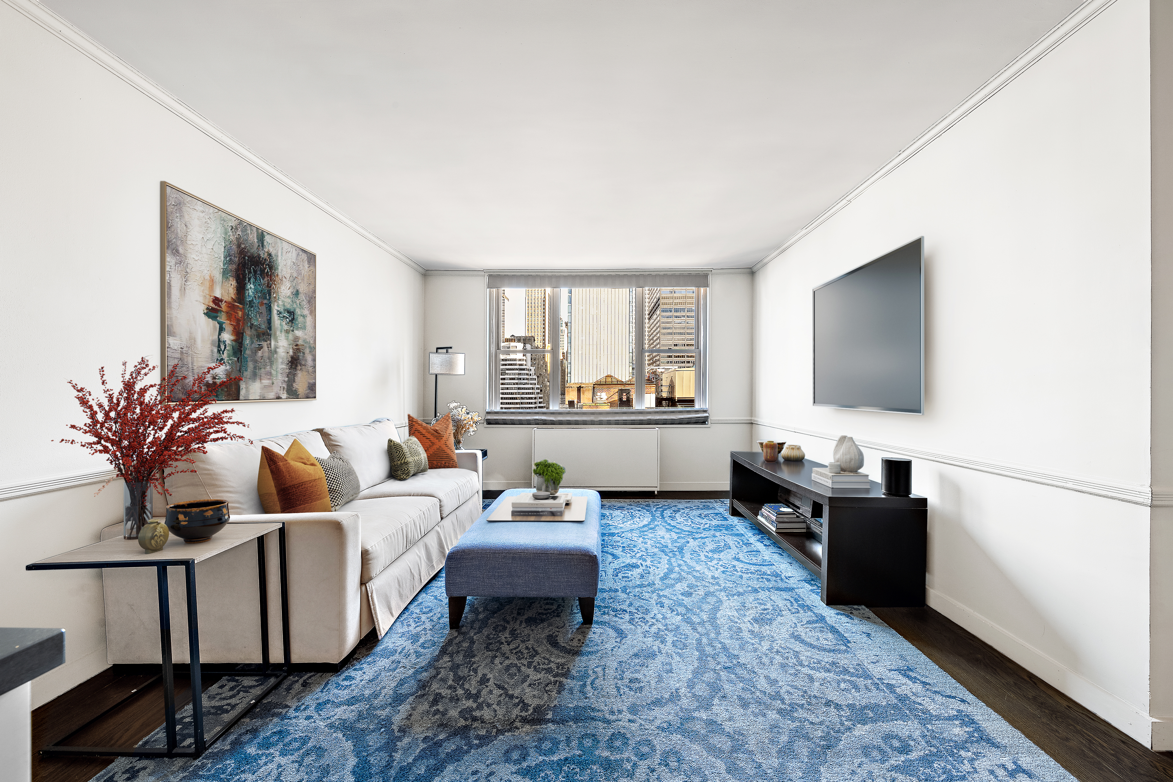 a living room with furniture and a flat screen tv