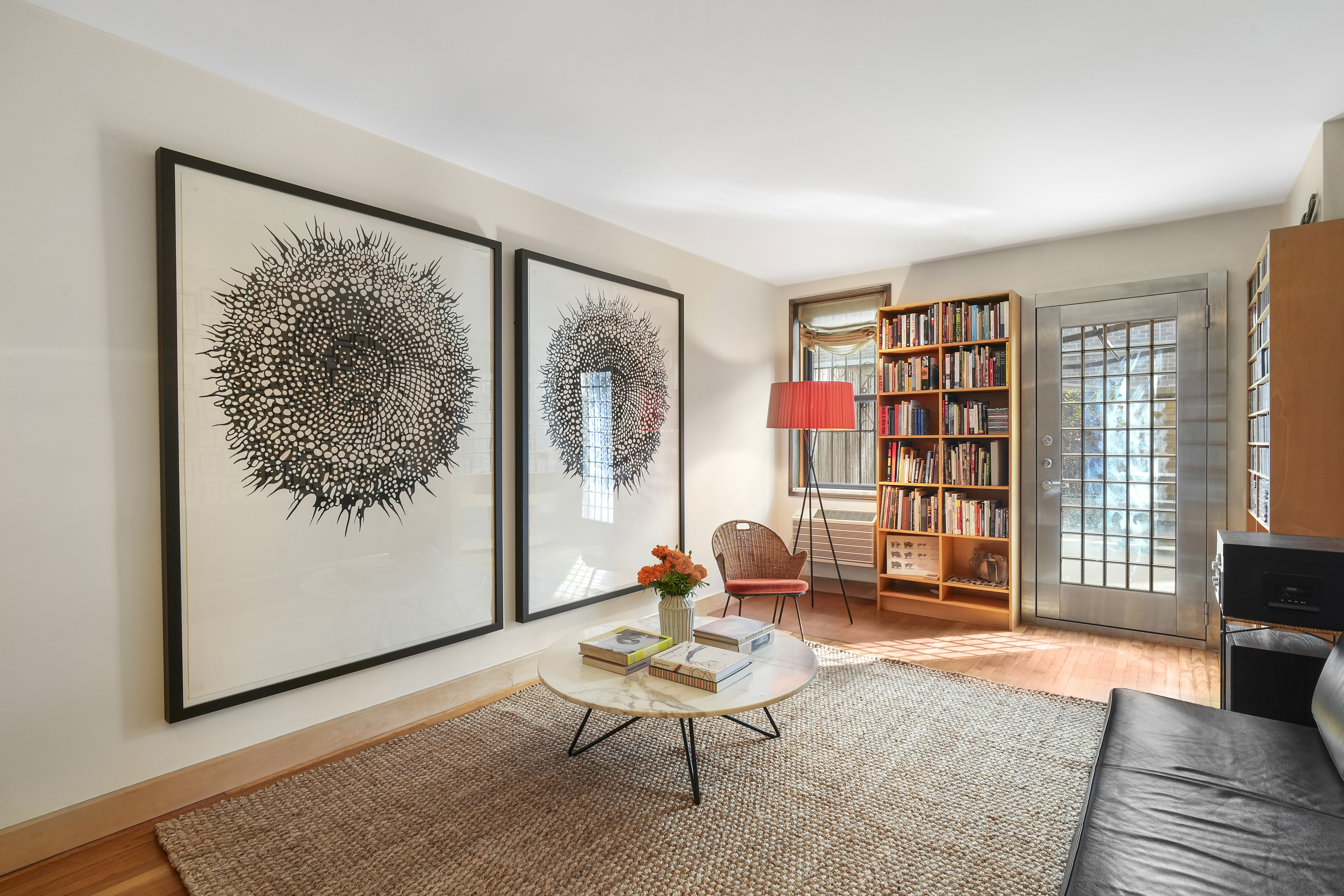 a living room with furniture and a window