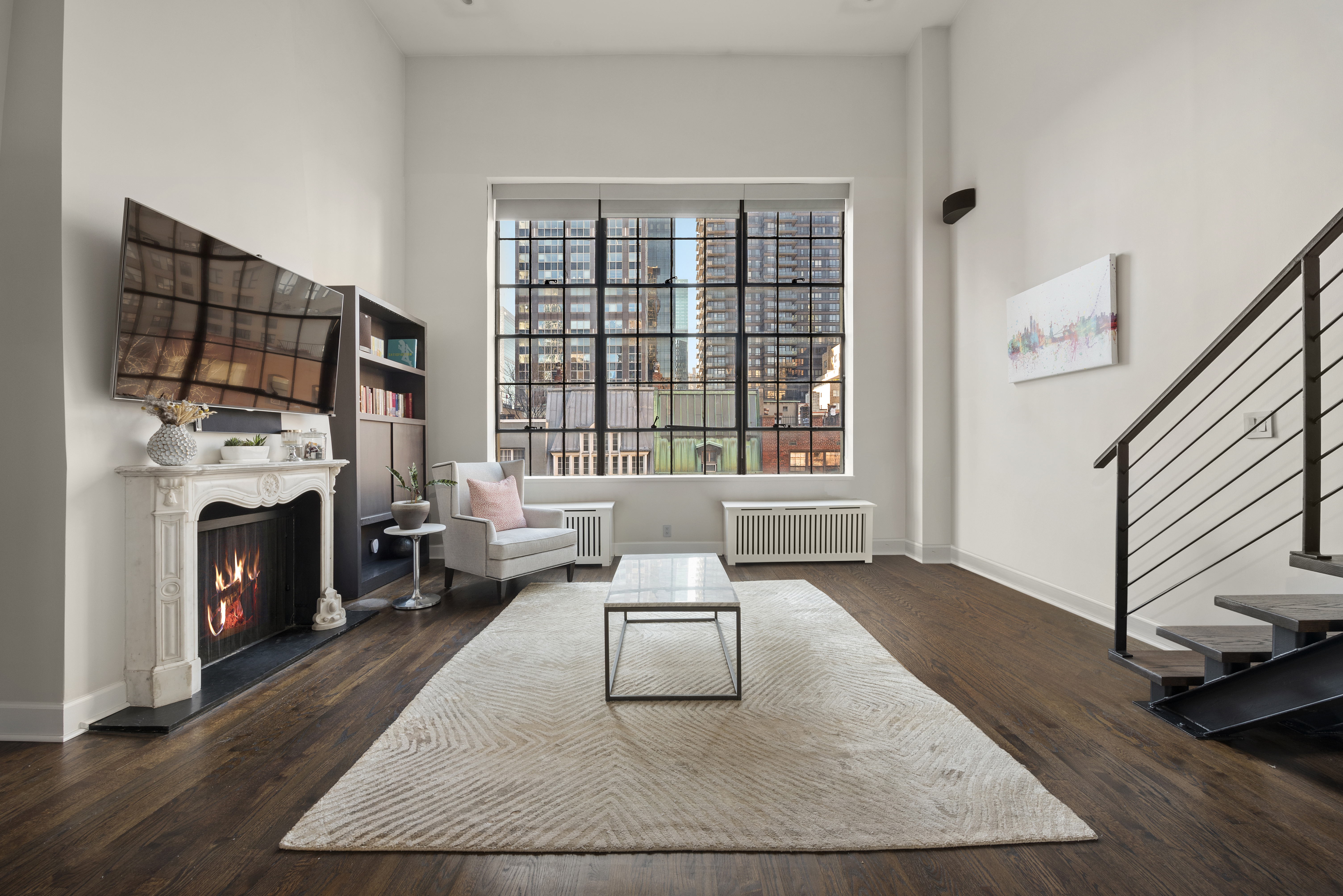 a living room with furniture fireplace and window