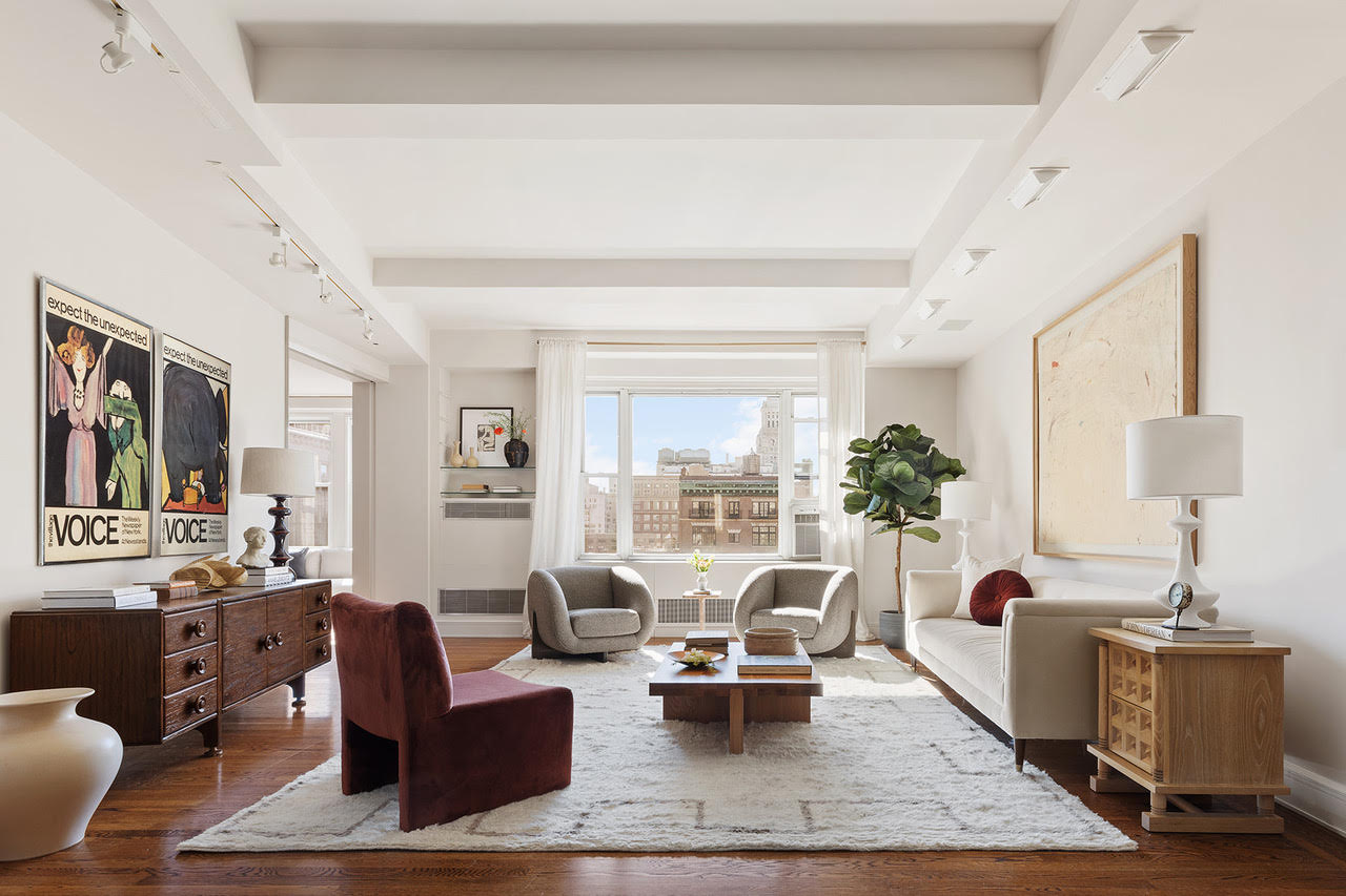 a living room with furniture rug and window