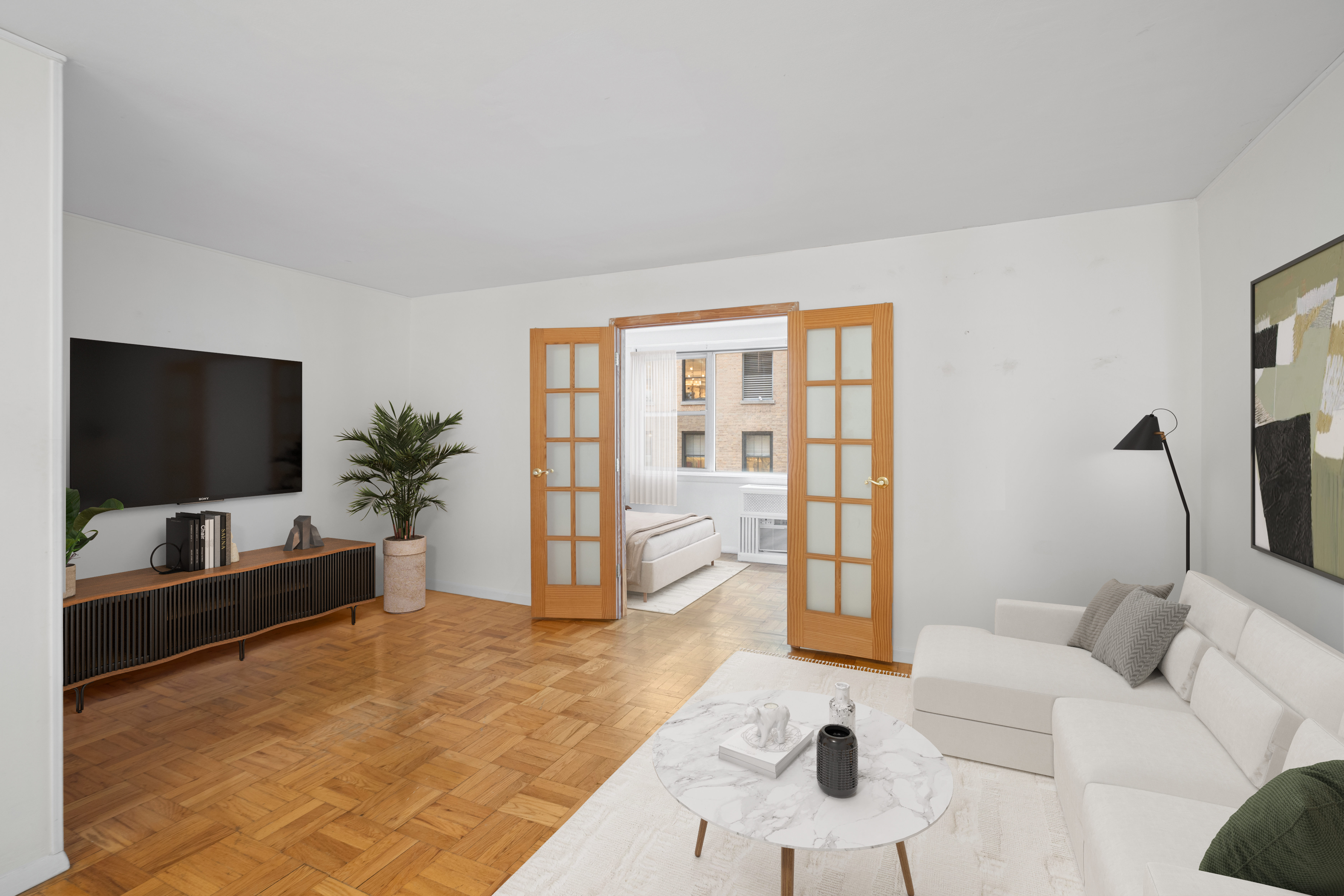 a living room with furniture and a flat screen tv