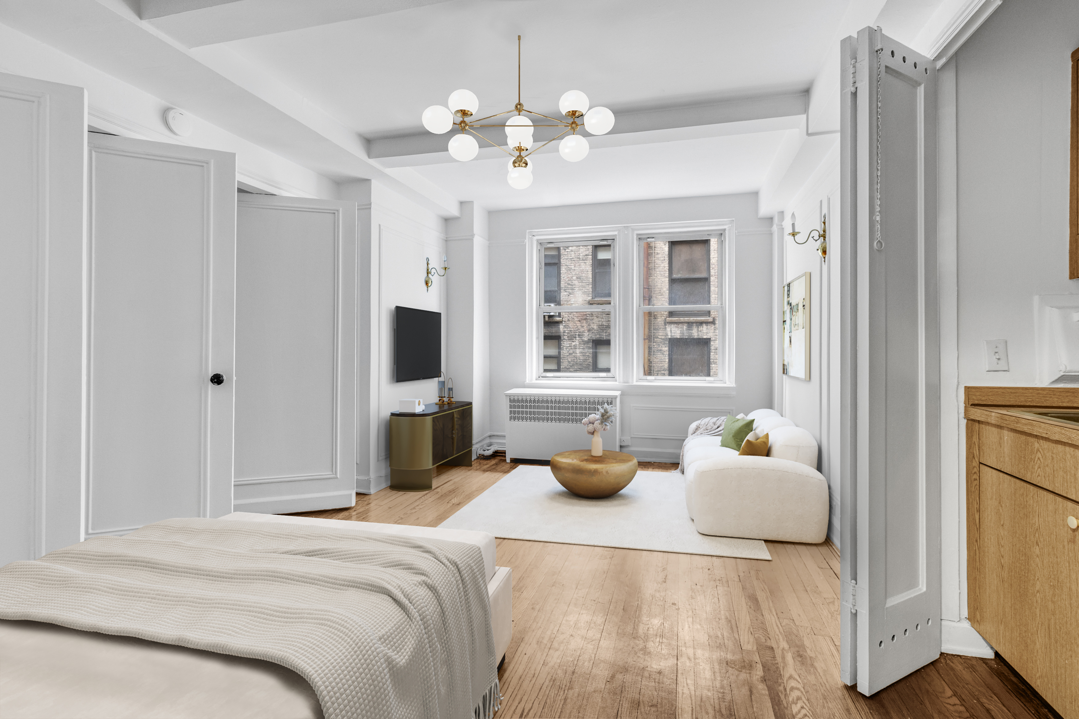 a bedroom with a bed and a chandelier