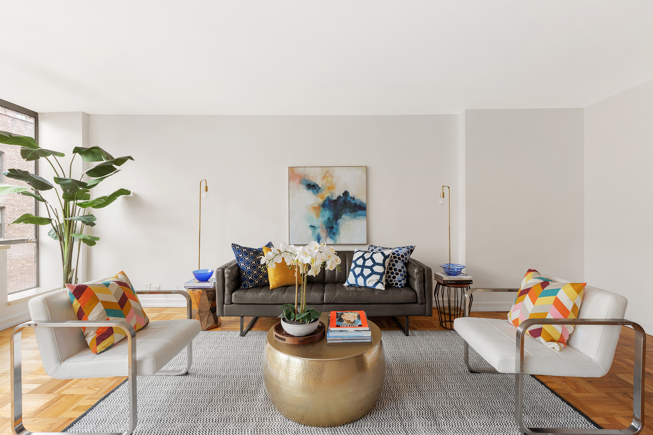 a living room with furniture and flowers