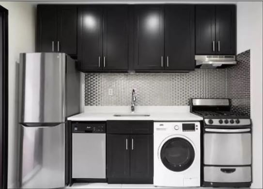 a kitchen with stainless steel appliances a refrigerator sink and cabinets