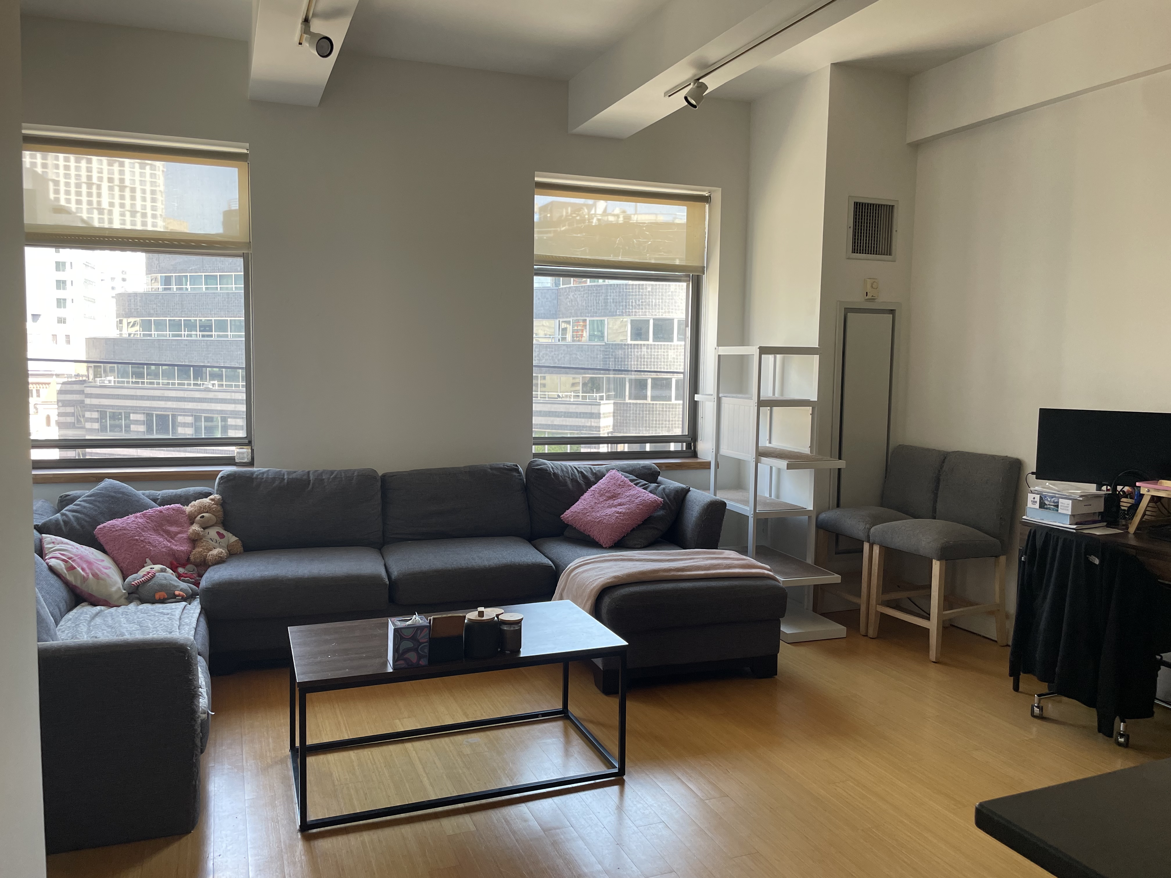 a living room with furniture and a flat screen tv