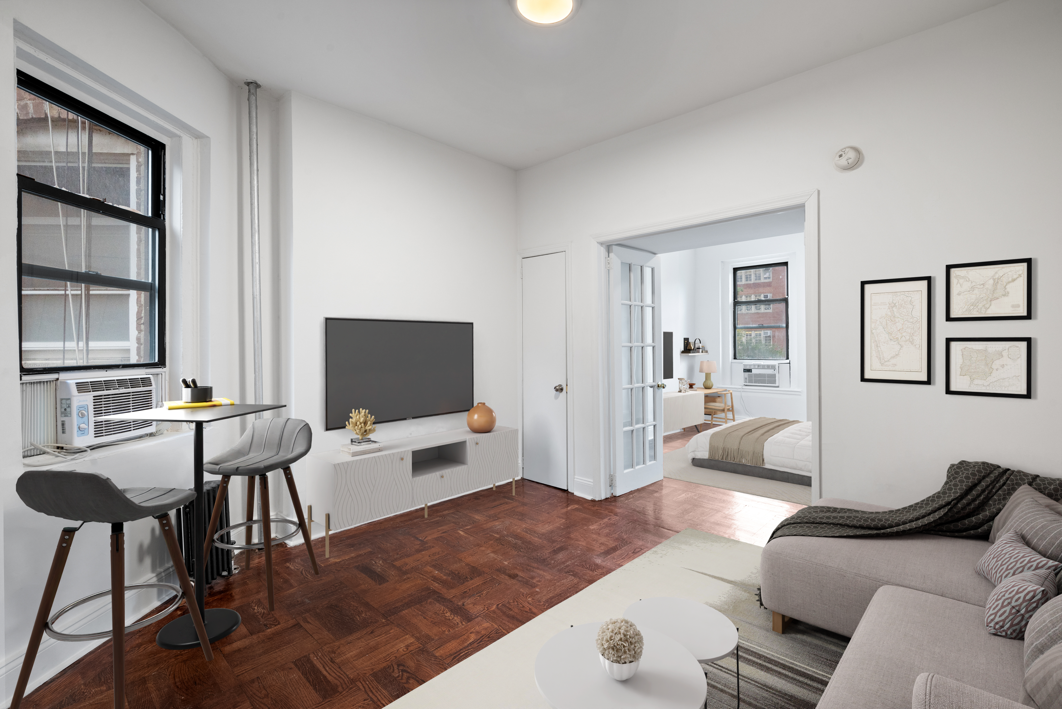 a living room with furniture and a flat screen tv