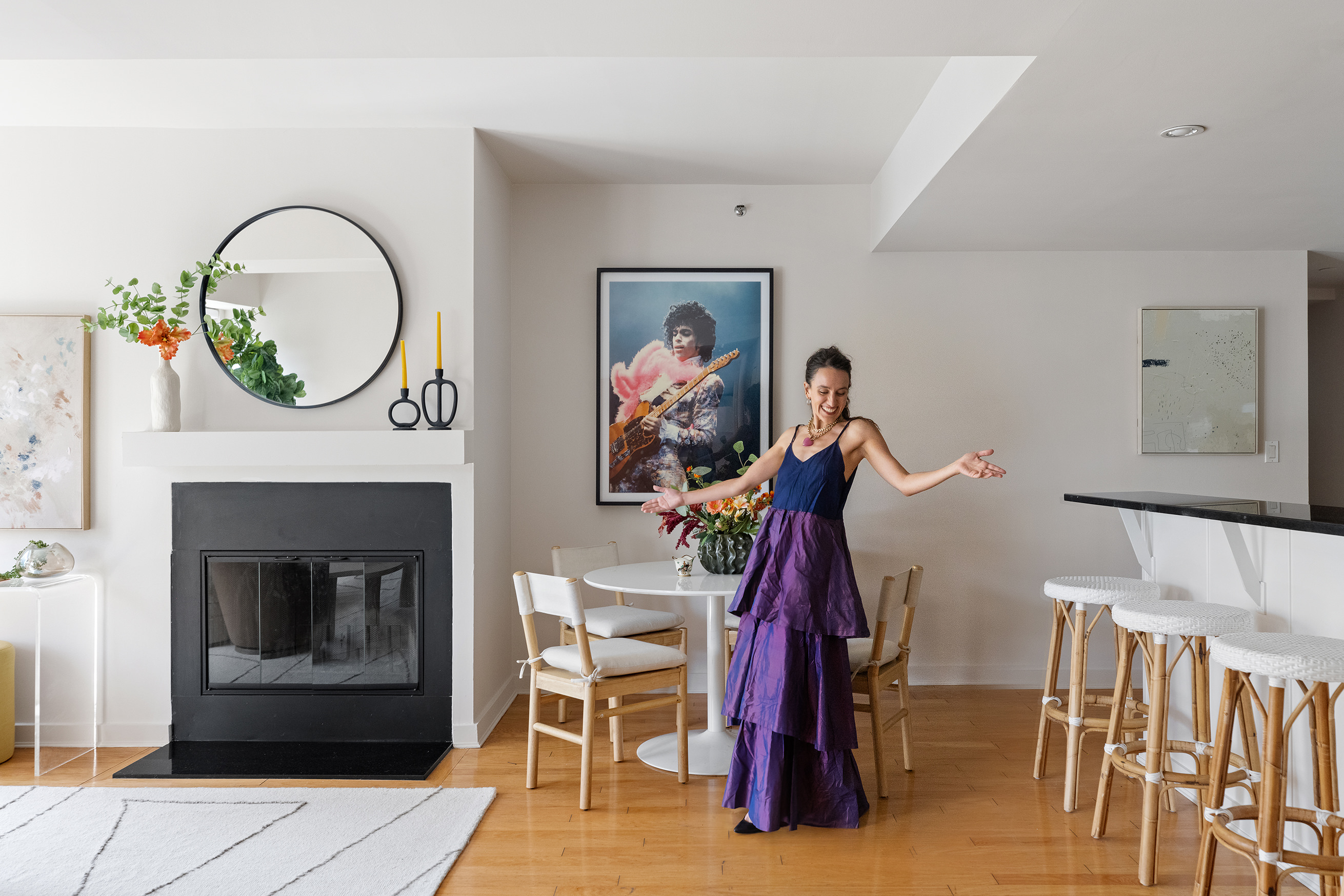 a view of hall way with furniture and a fireplace