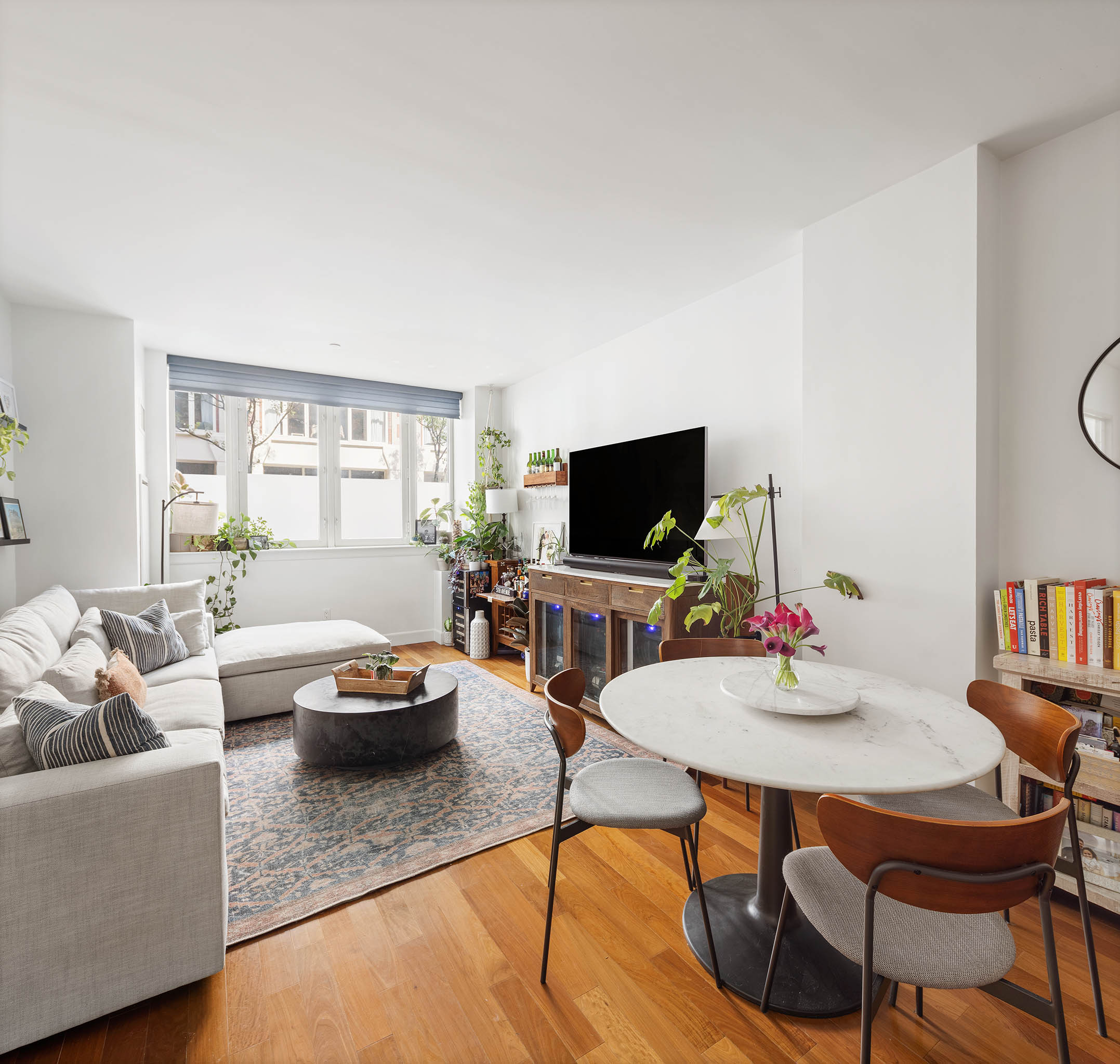 a living room with furniture and a flat screen tv