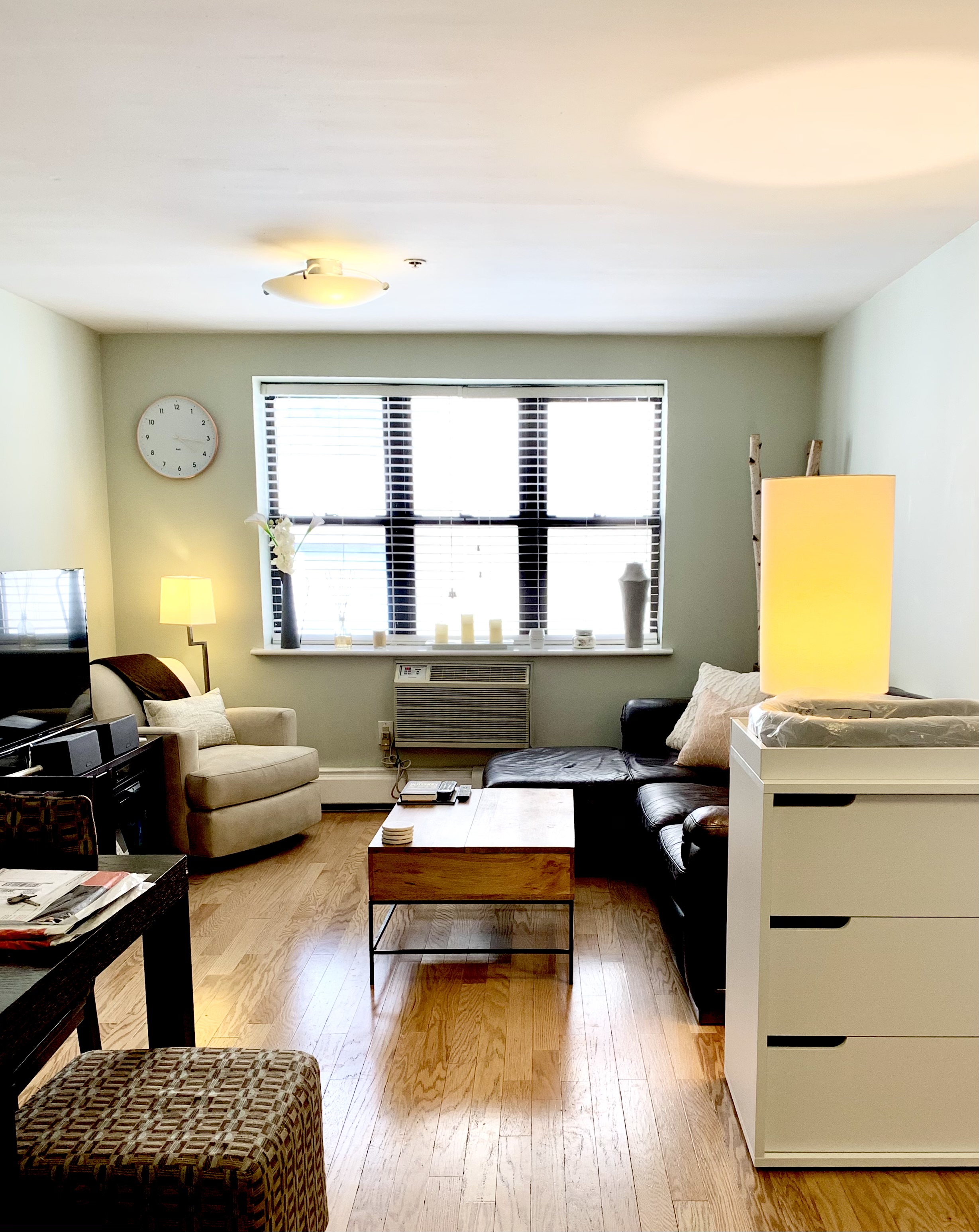 a work room with furniture and a window