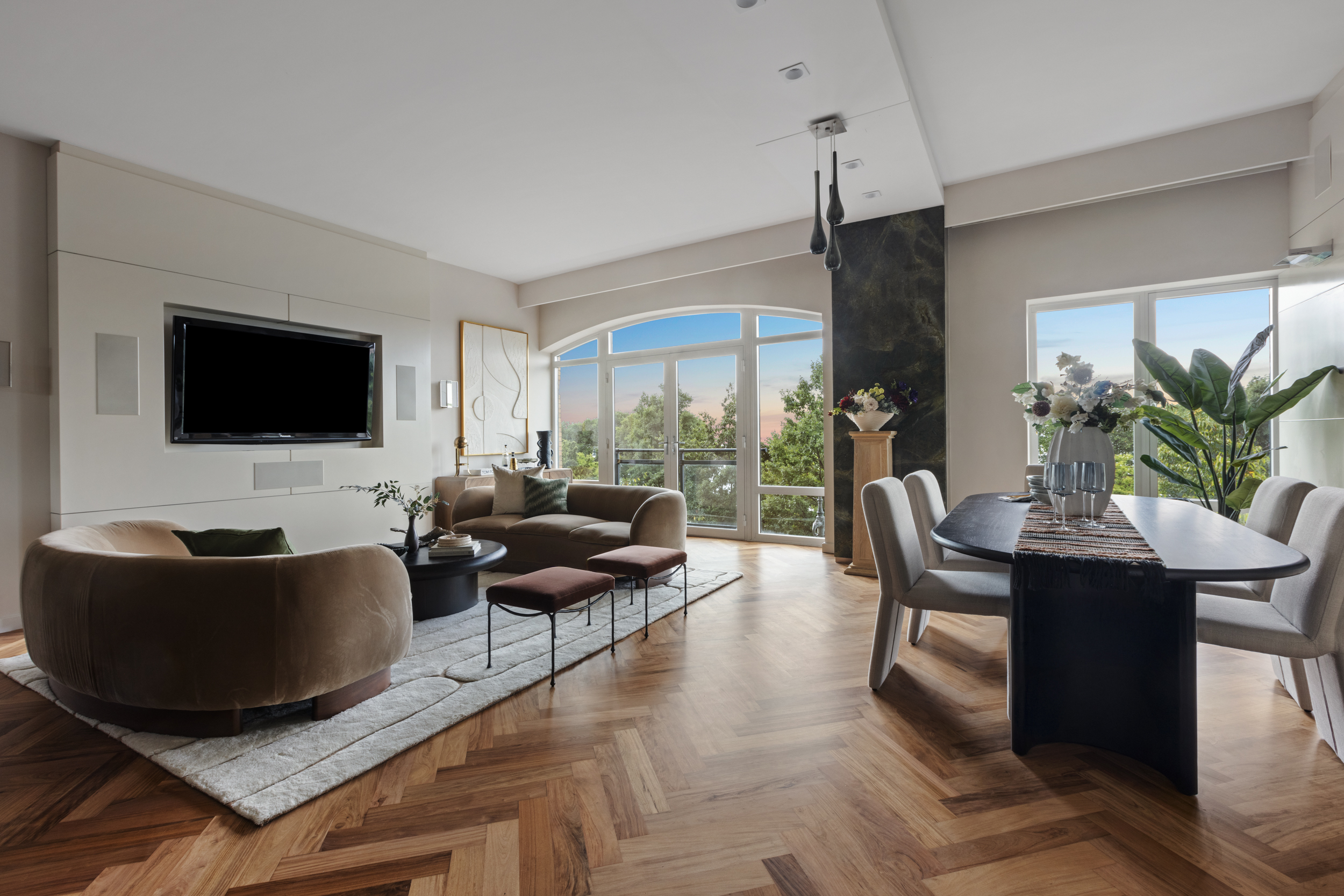 a living room with furniture and a flat screen tv