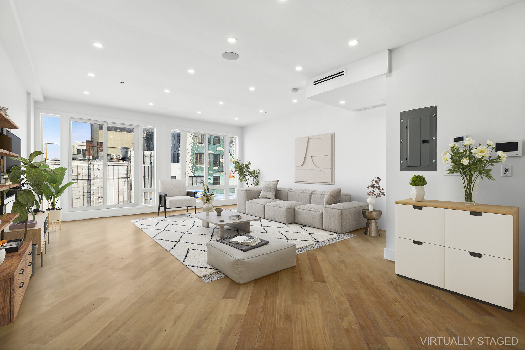 a living room with furniture and a large mirror