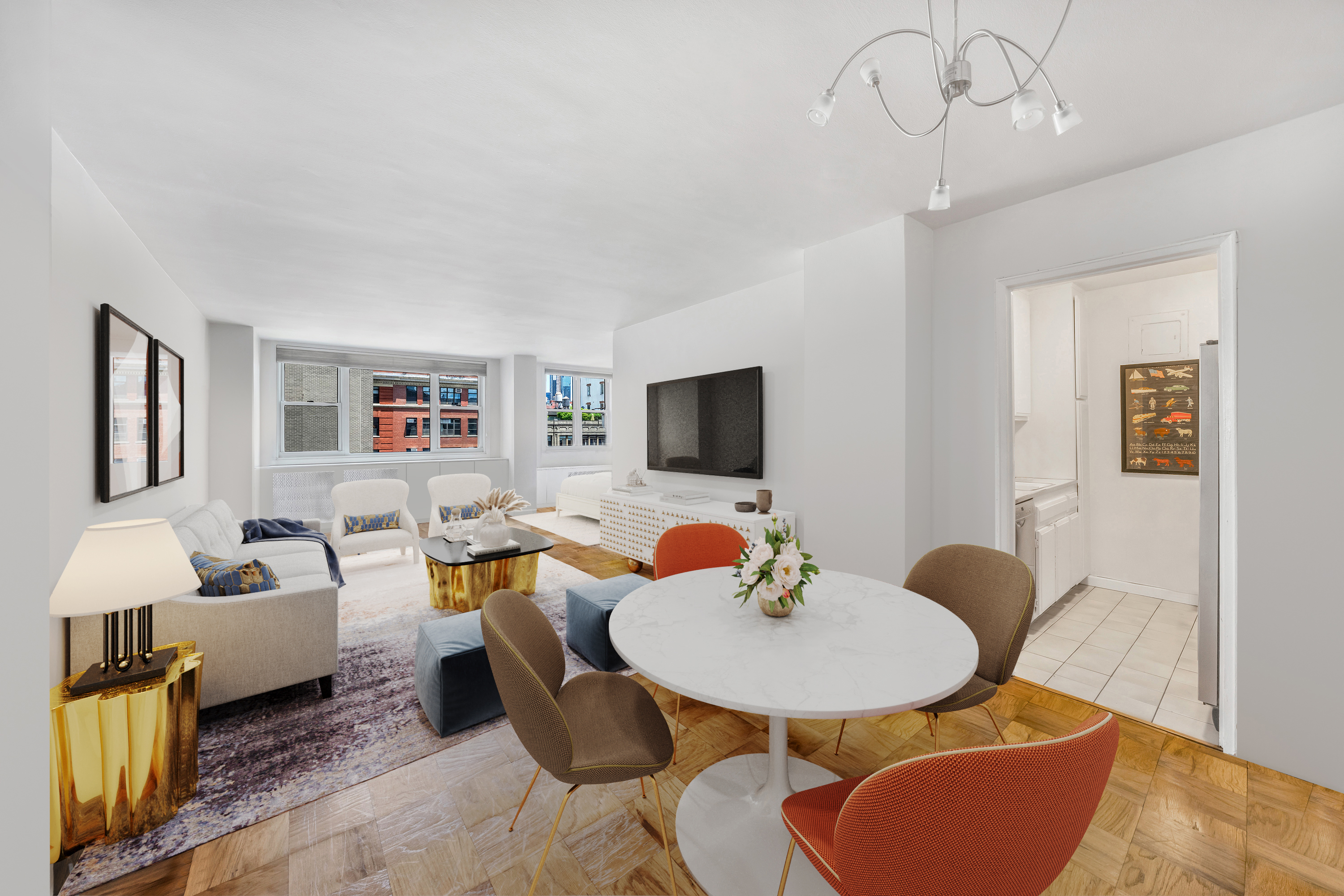 a living room with furniture kitchen view and a flat screen tv