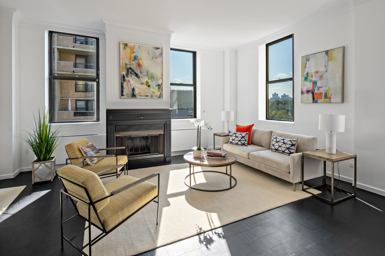 a living room with furniture and a fireplace