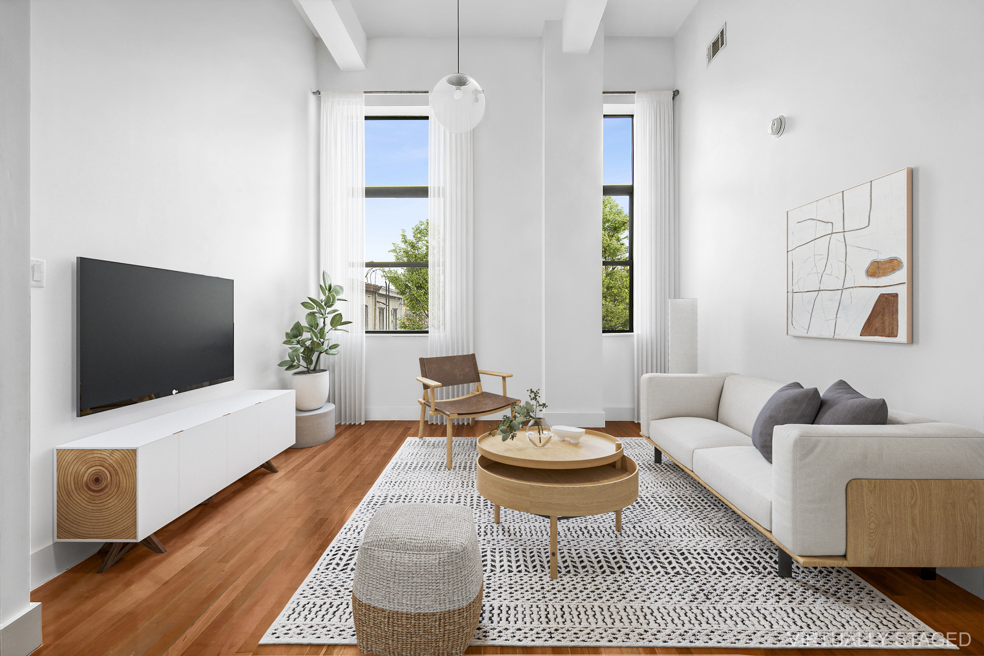 a living room with furniture and a flat screen tv