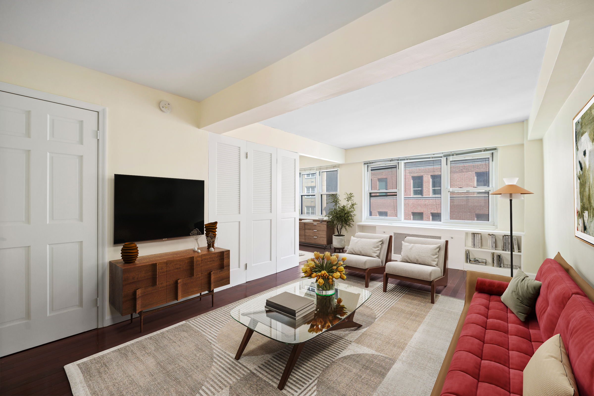 a living room with furniture and a flat screen tv