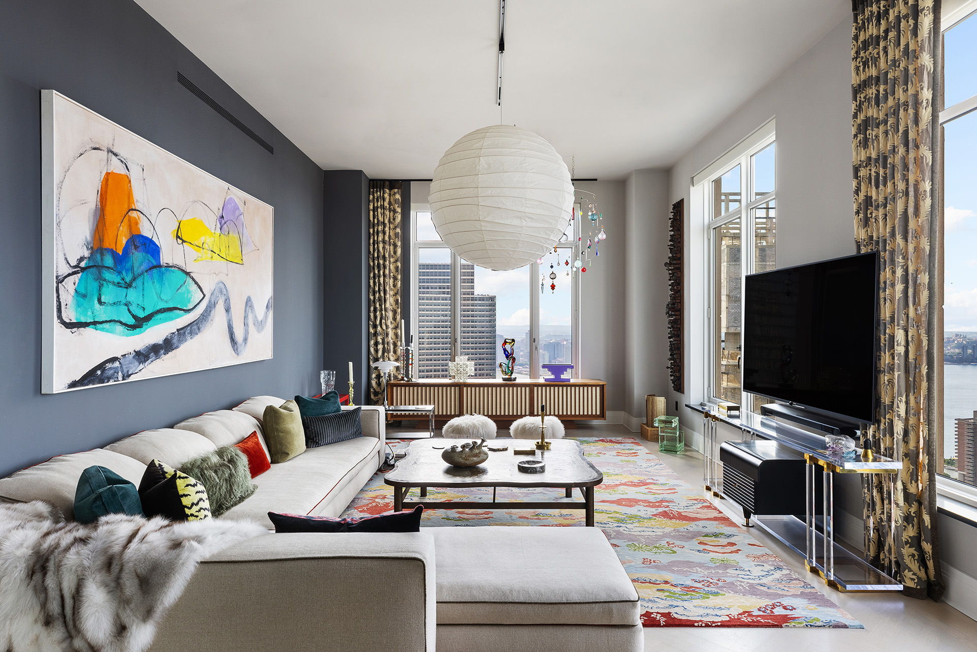 a living room with furniture and a flat screen tv