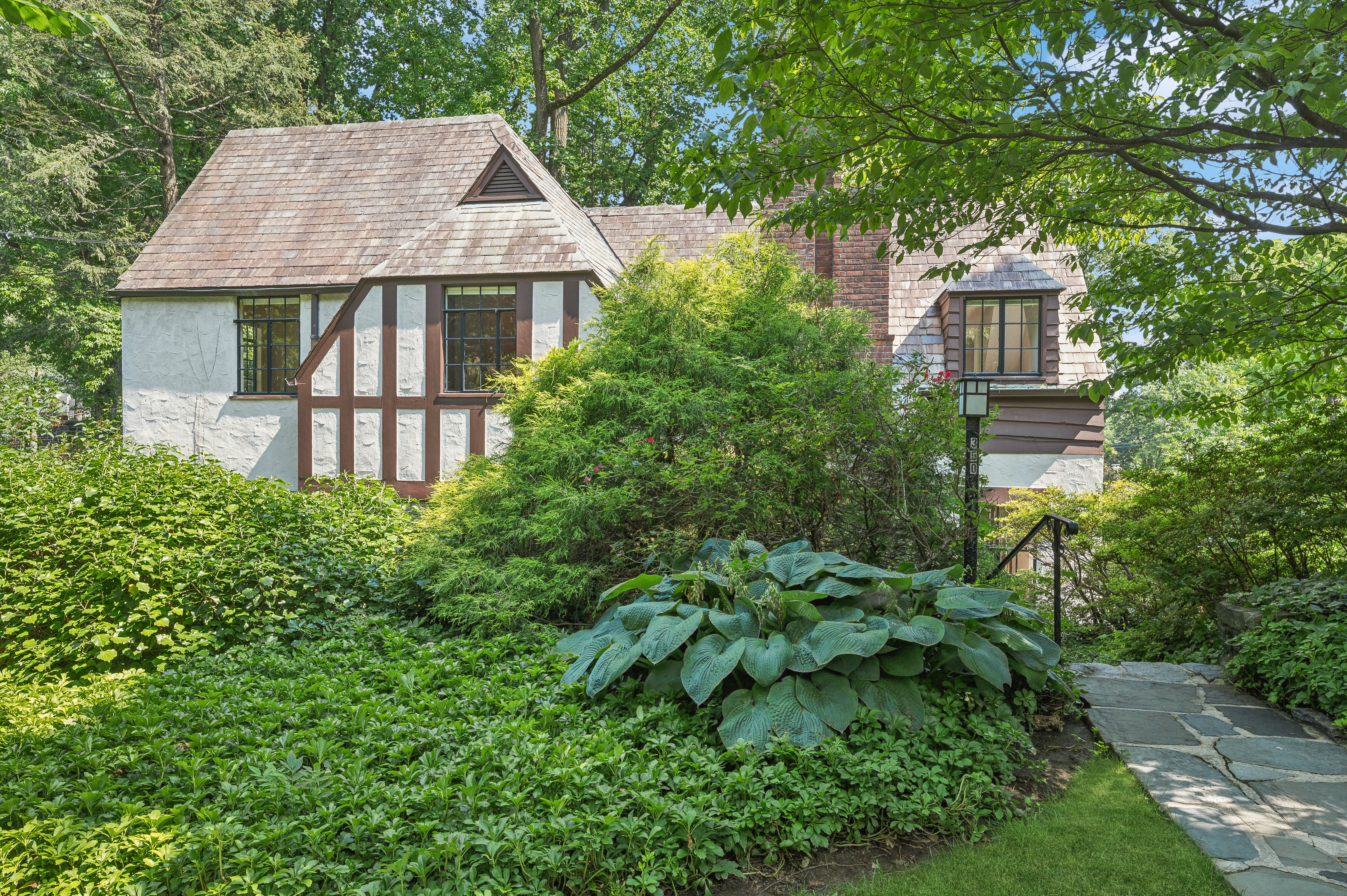 front view of a house with a yard