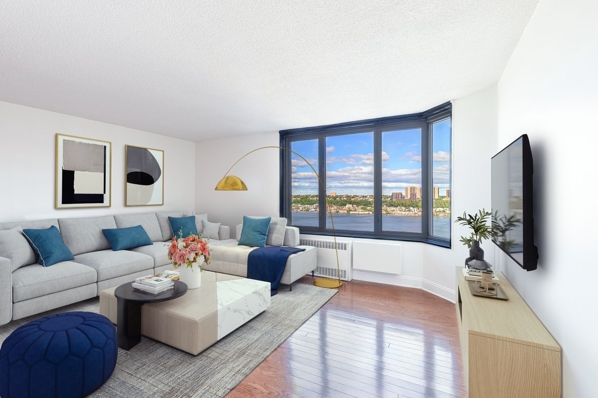 a living room with furniture and a flat screen tv