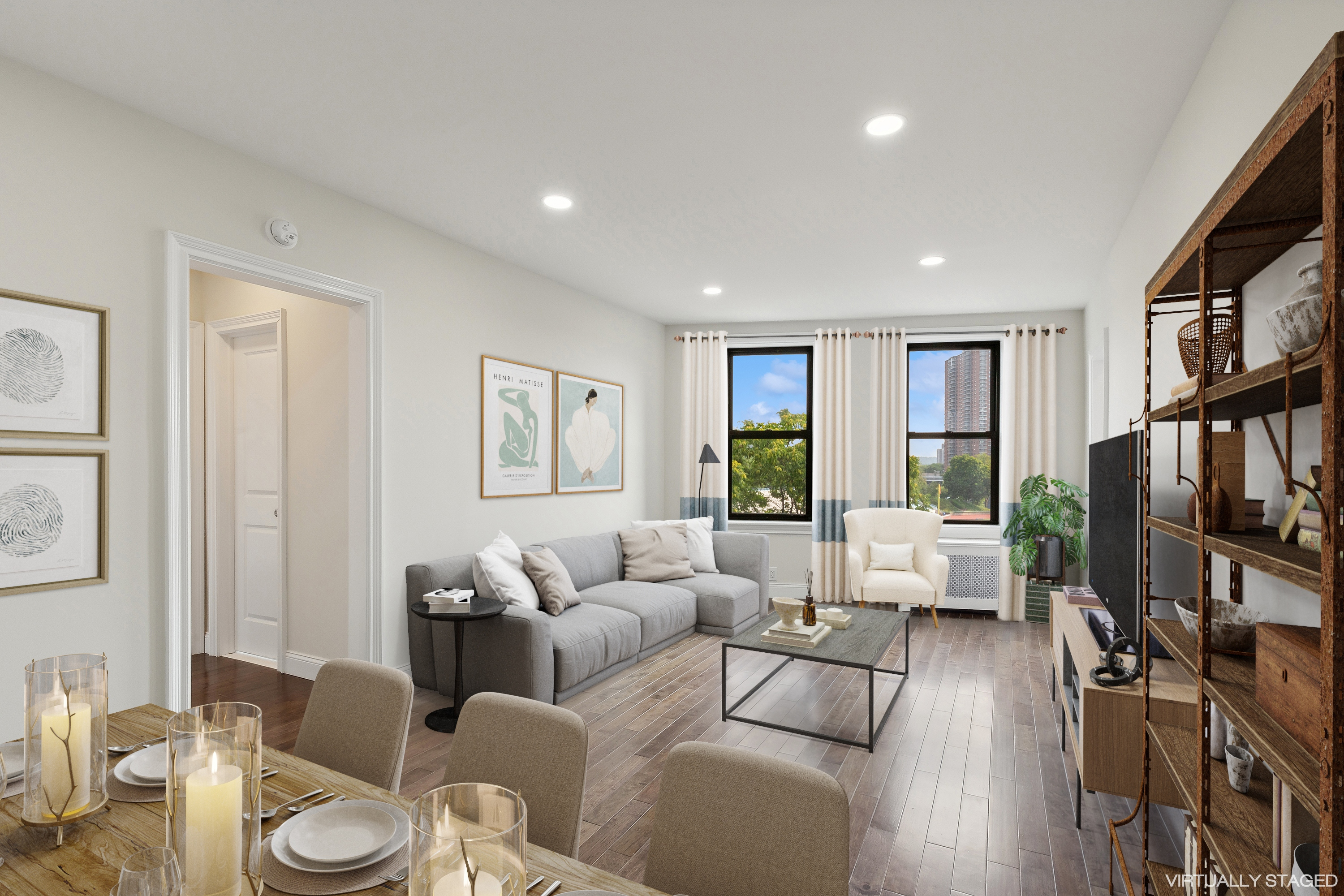 a living room with furniture large window and a flat screen tv