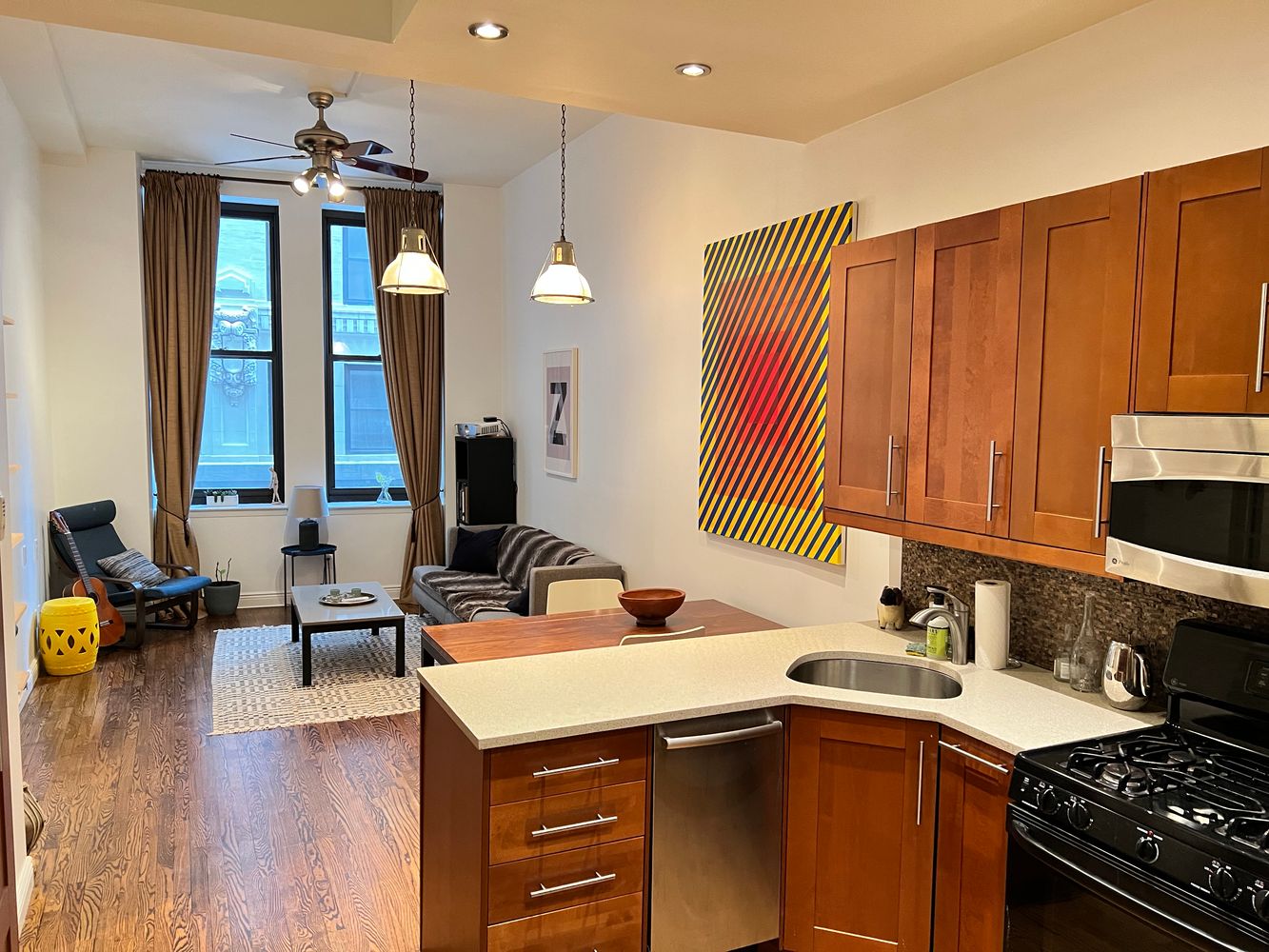 a kitchen with a sink appliances and cabinets