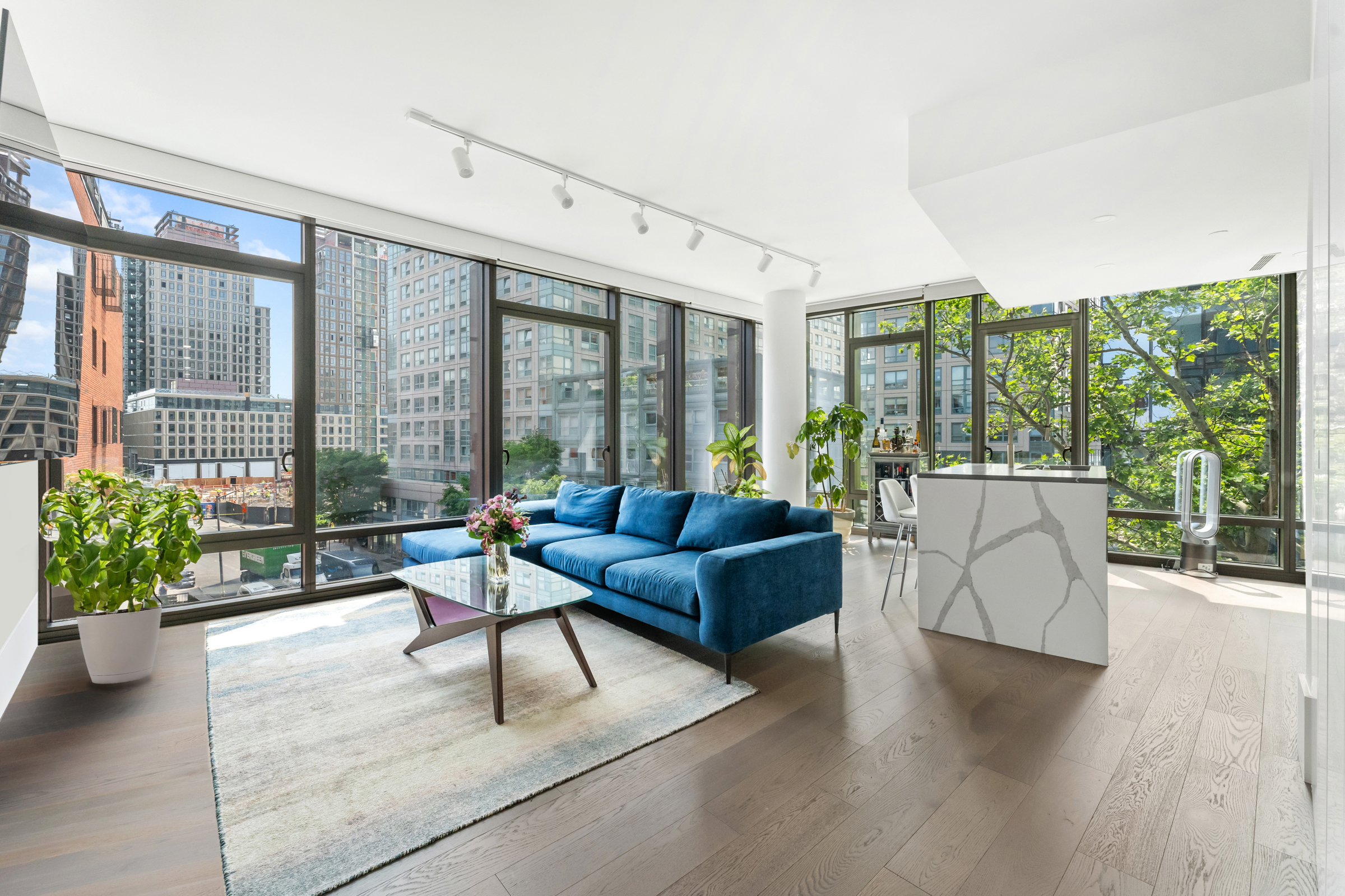 a living room with furniture and windows