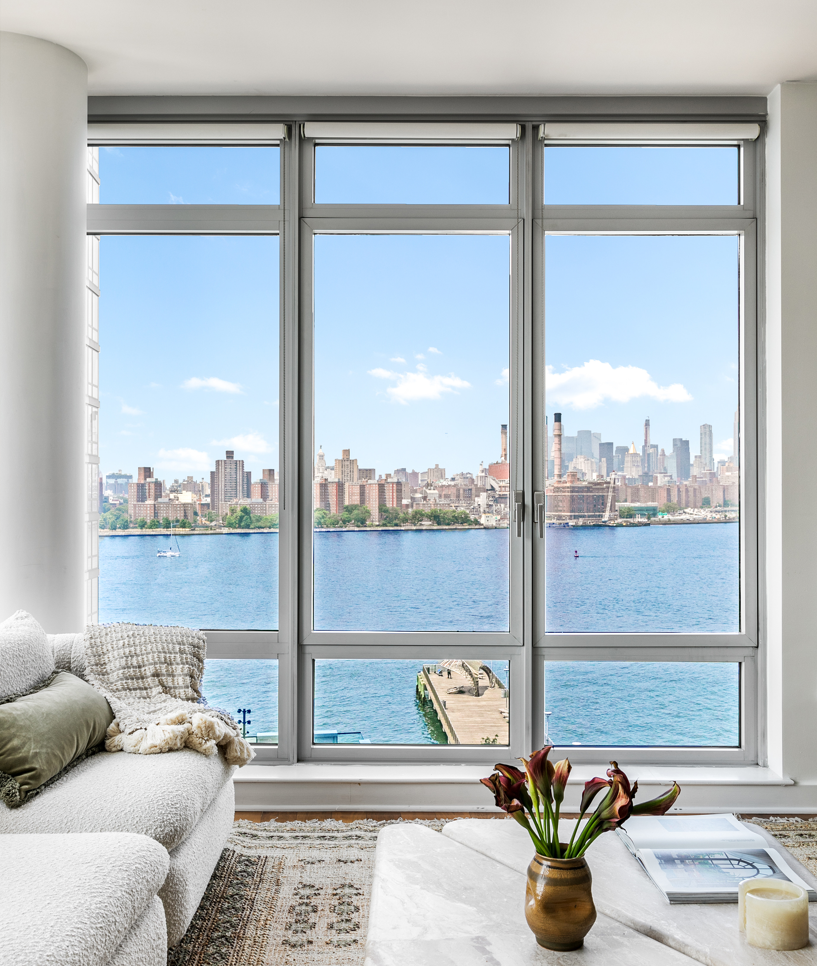 a living room with patio furniture and a window